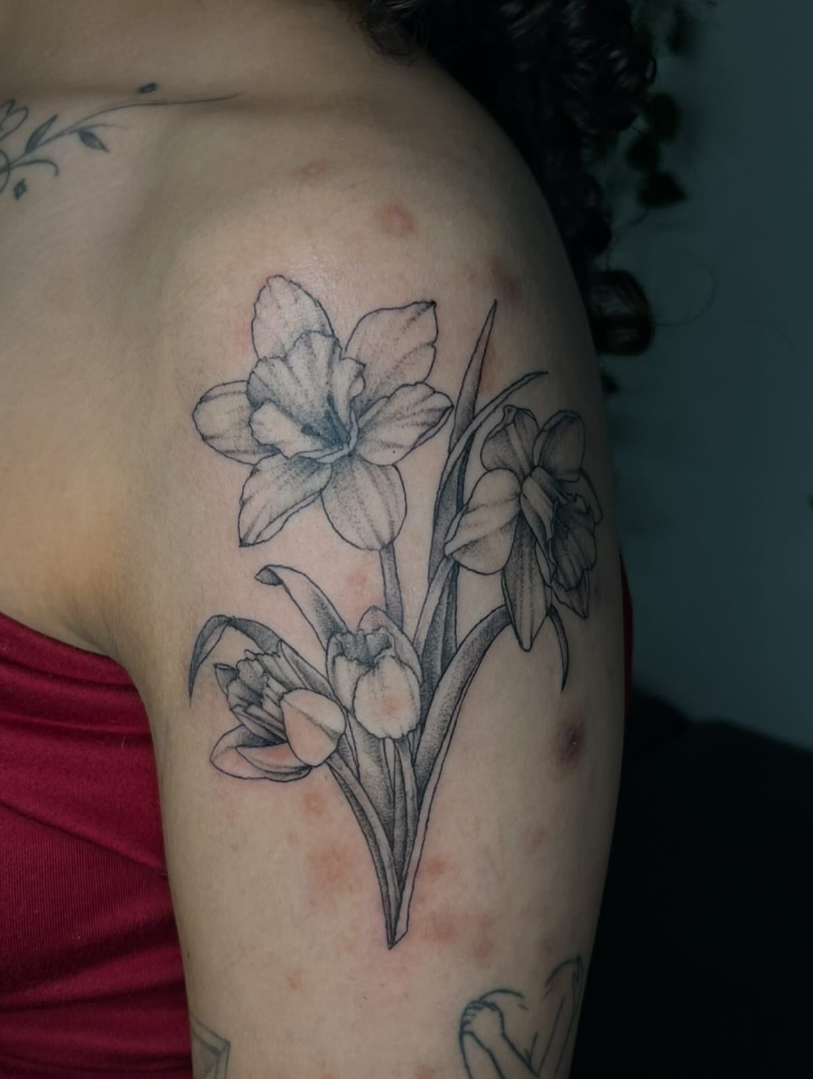 Daffodils black and grey tattoo on the shoulder by Luna 🌙