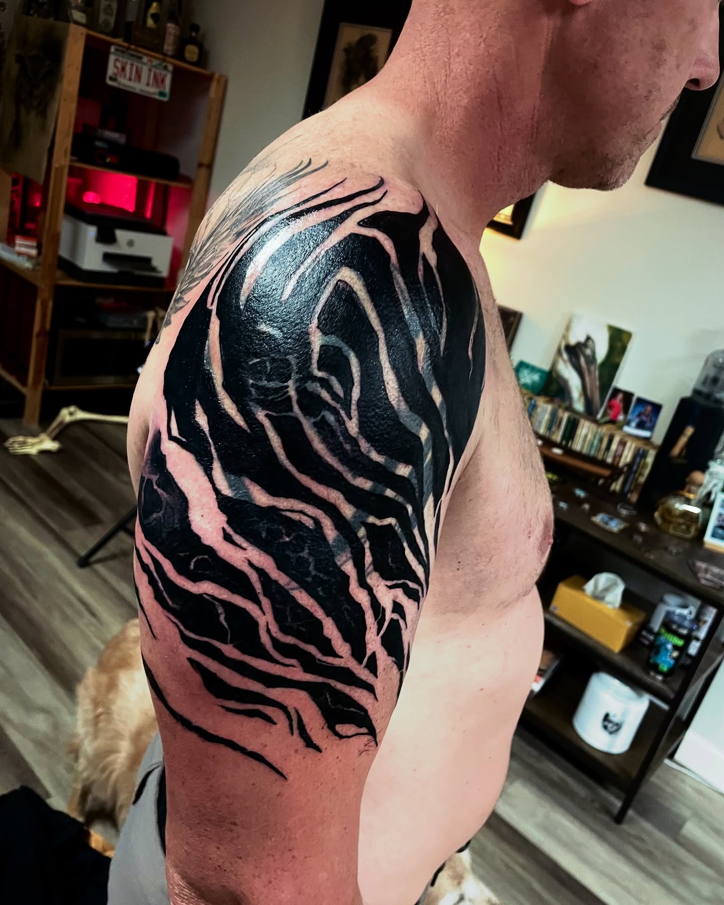 Abstract flame black and grey tattoo on the shoulder by David Garner, Los Angeles, California