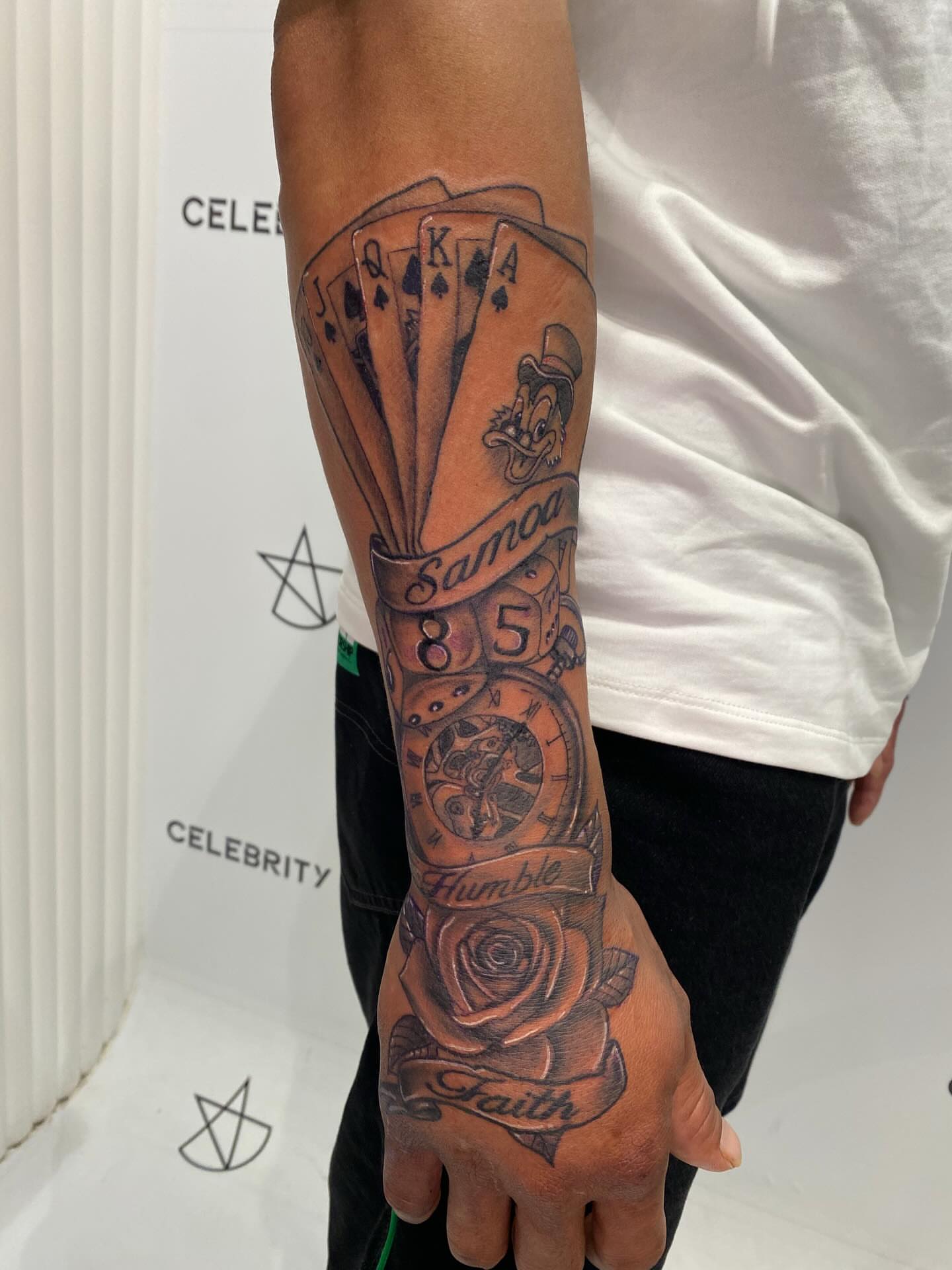 Playing cards and clock black and grey tattoo on the forearm by @dom_macio_tattoo
