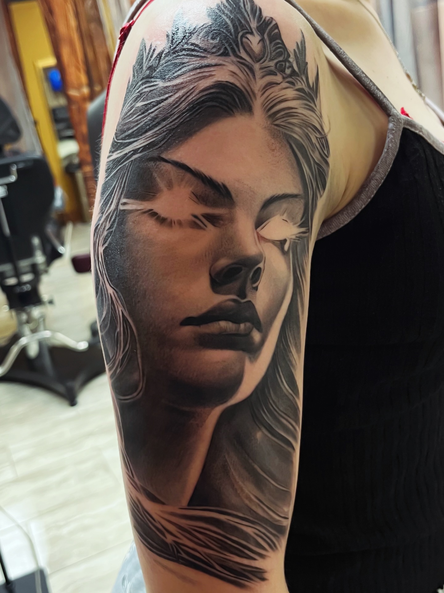 Woman's face realism tattoo on the forearm by Quinten Harper