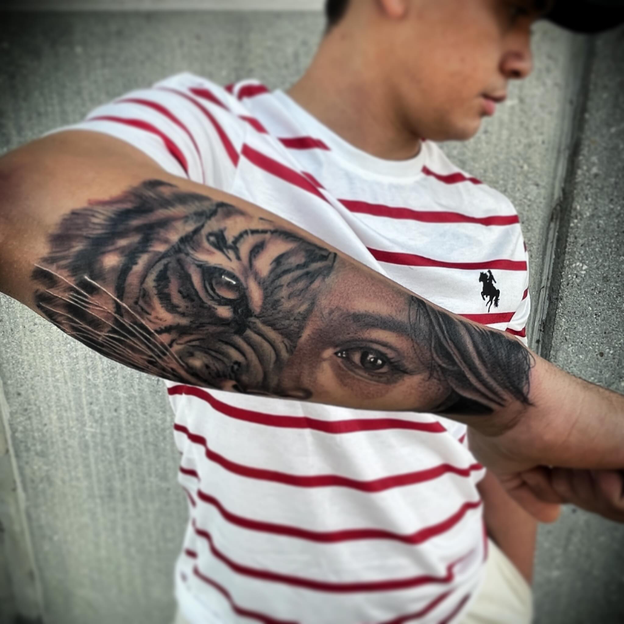 Tiger and human eye realism tattoo on the forearm by Chato
