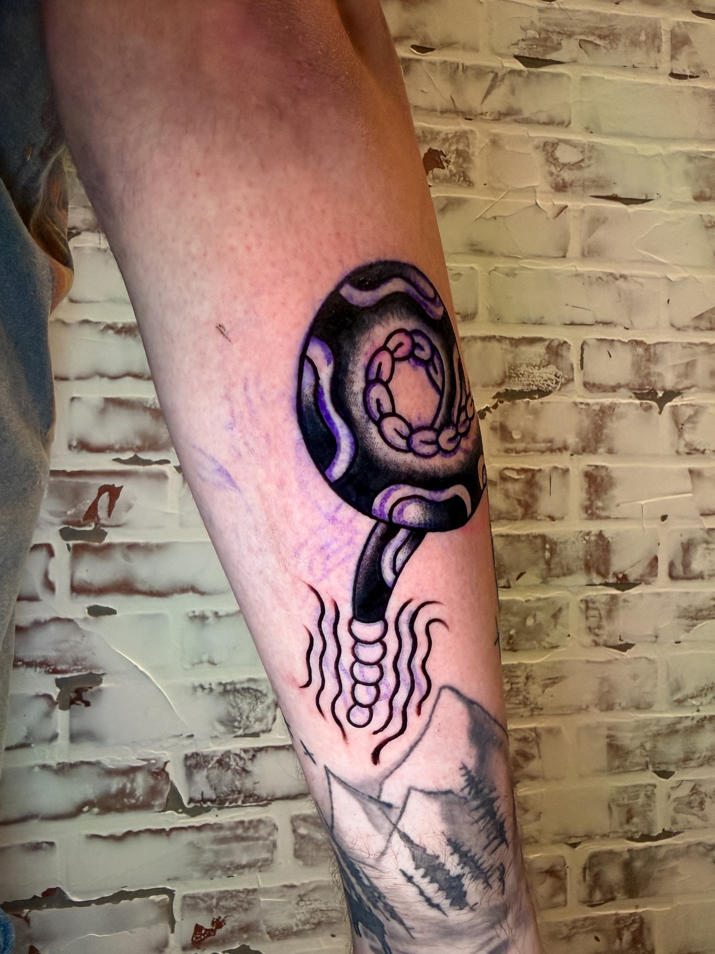 Amphibian dotwork tattoo on the forearm by Brandt Norcross
