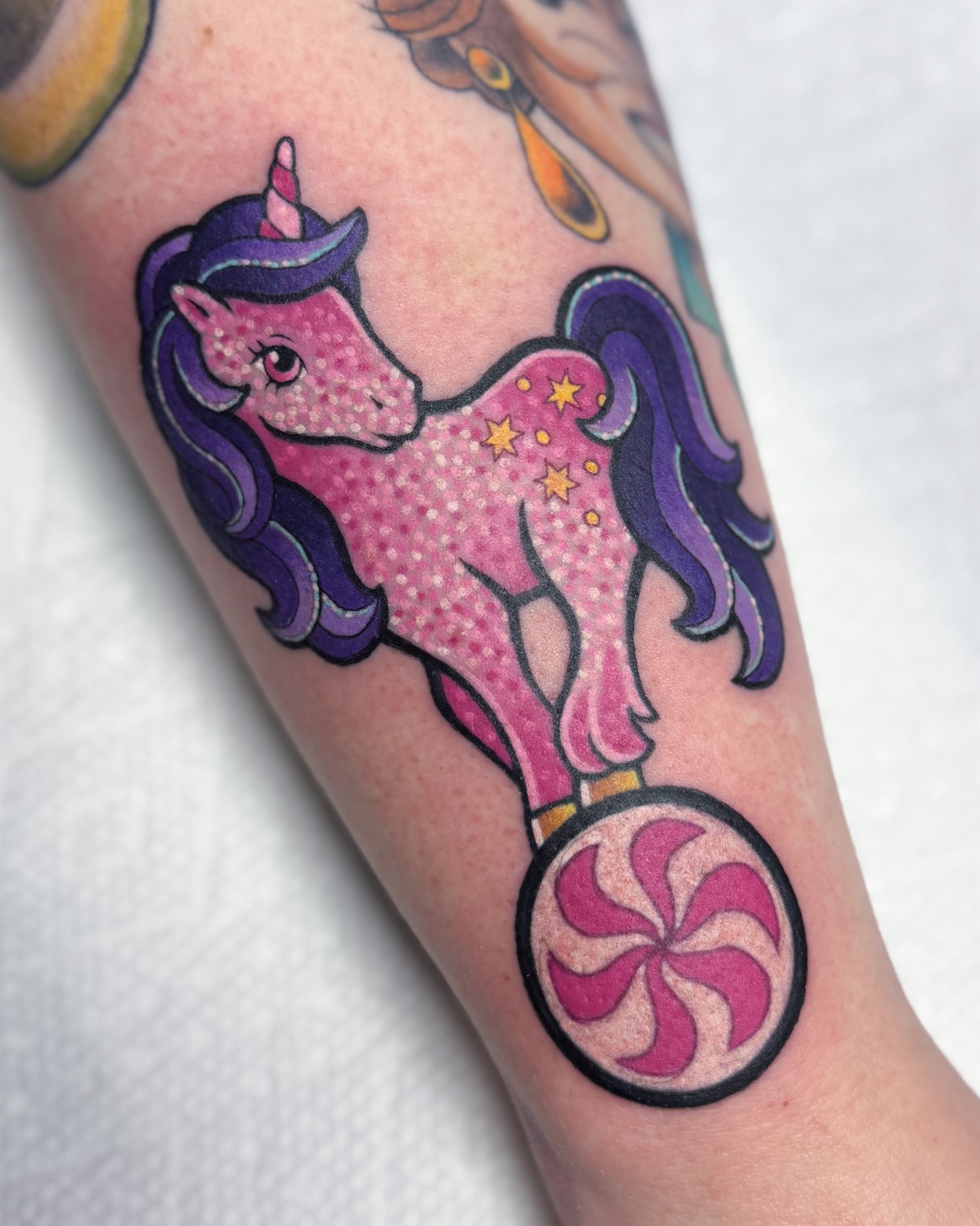 Unicorns dotwork tattoo on the forearm by Janine Ramos