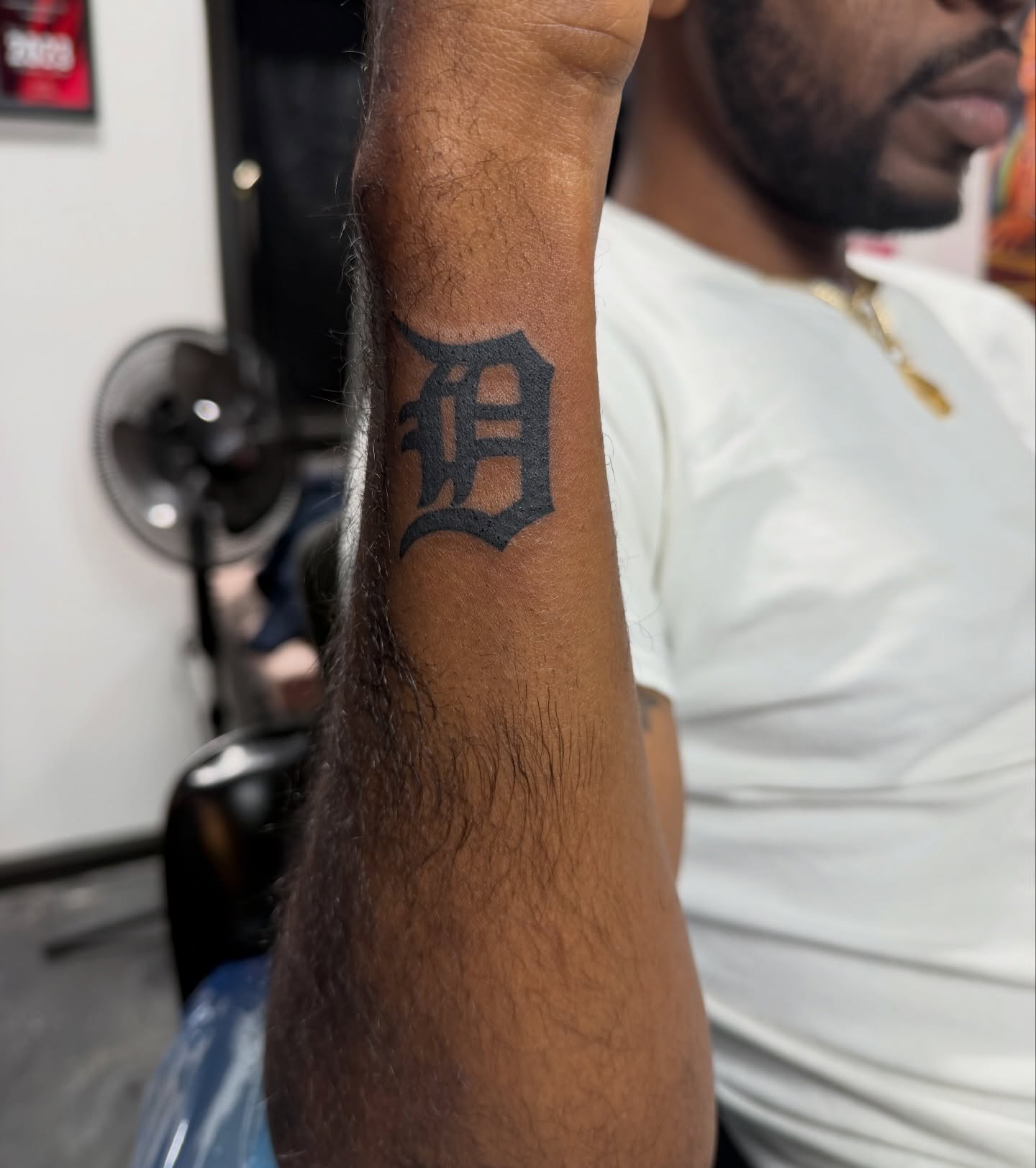 Letter D black and grey tattoo on the forearm by CandiCoatedInk