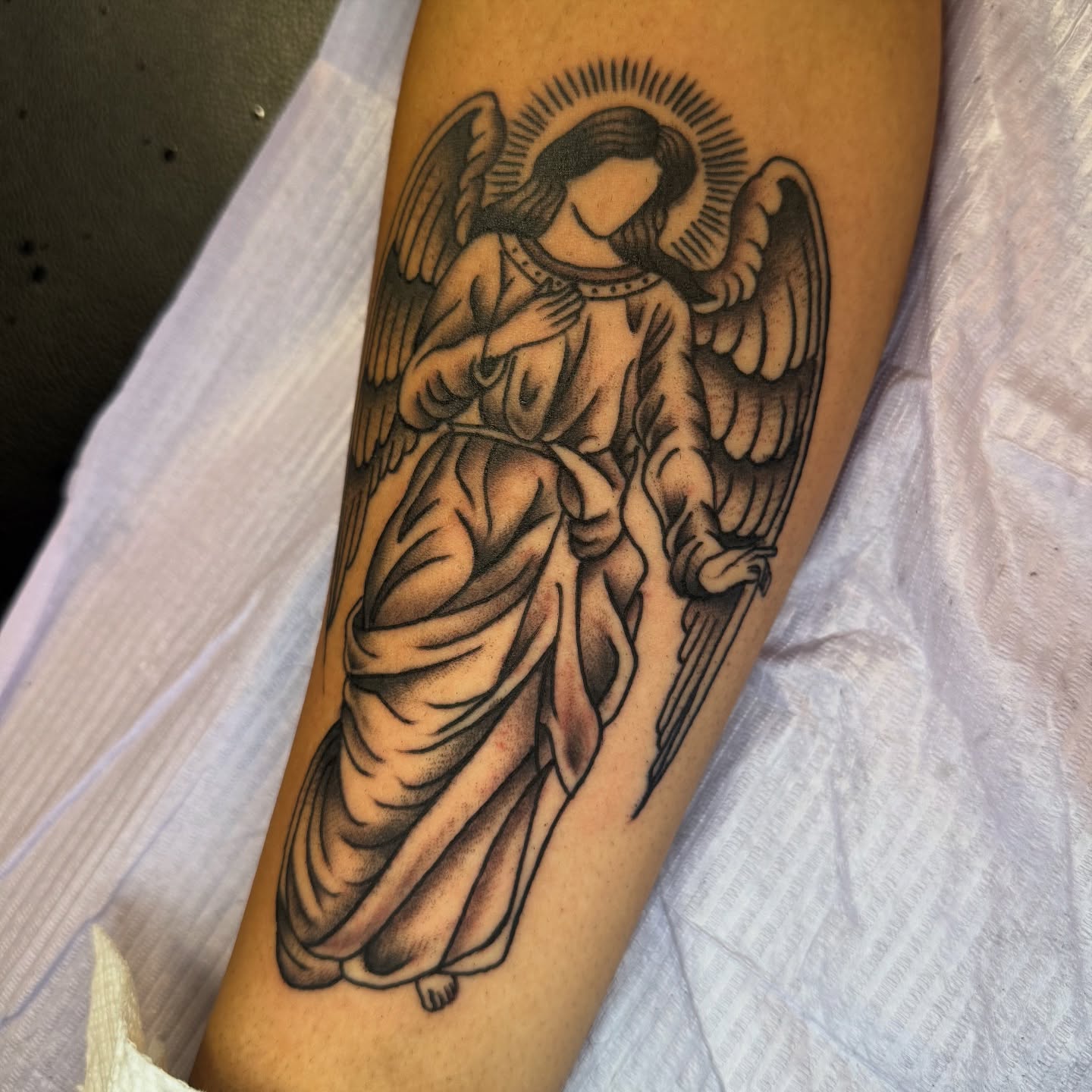 Angel black and grey tattoo on the forearm by @ryanpereztattoo