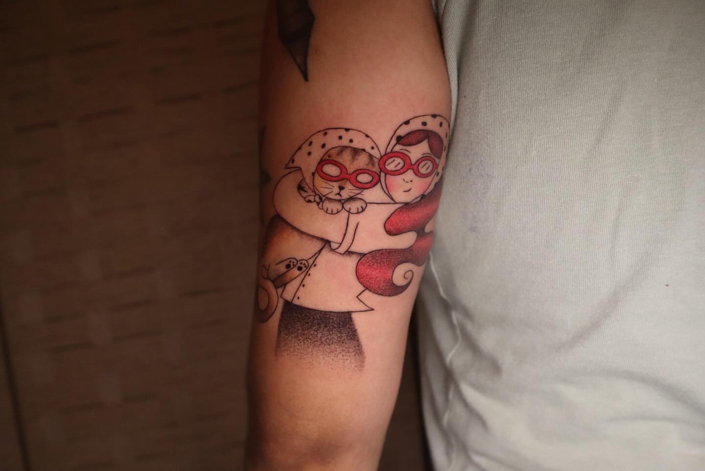 Cat and girl dotwork tattoo on the forearm by dani
