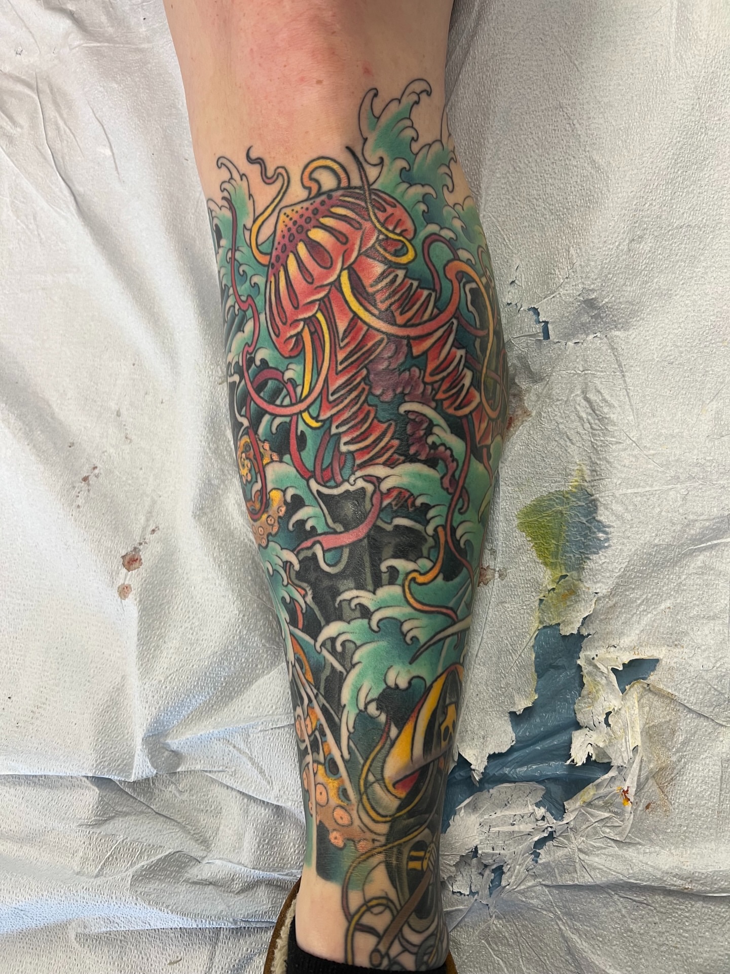 Koi fish and waves japanese irezumi tattoo on the calf by Corey Thompson, Butler, Pennsylvania