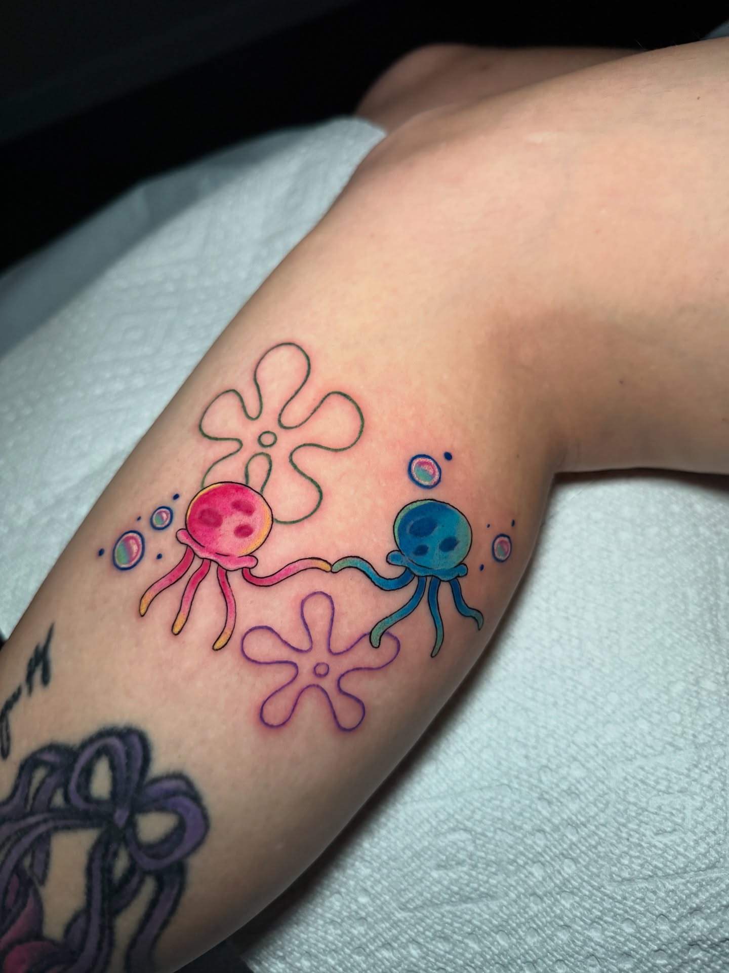 Octopus and sea anemone new school tattoo on the forearm by 𝕹𝖆𝖙