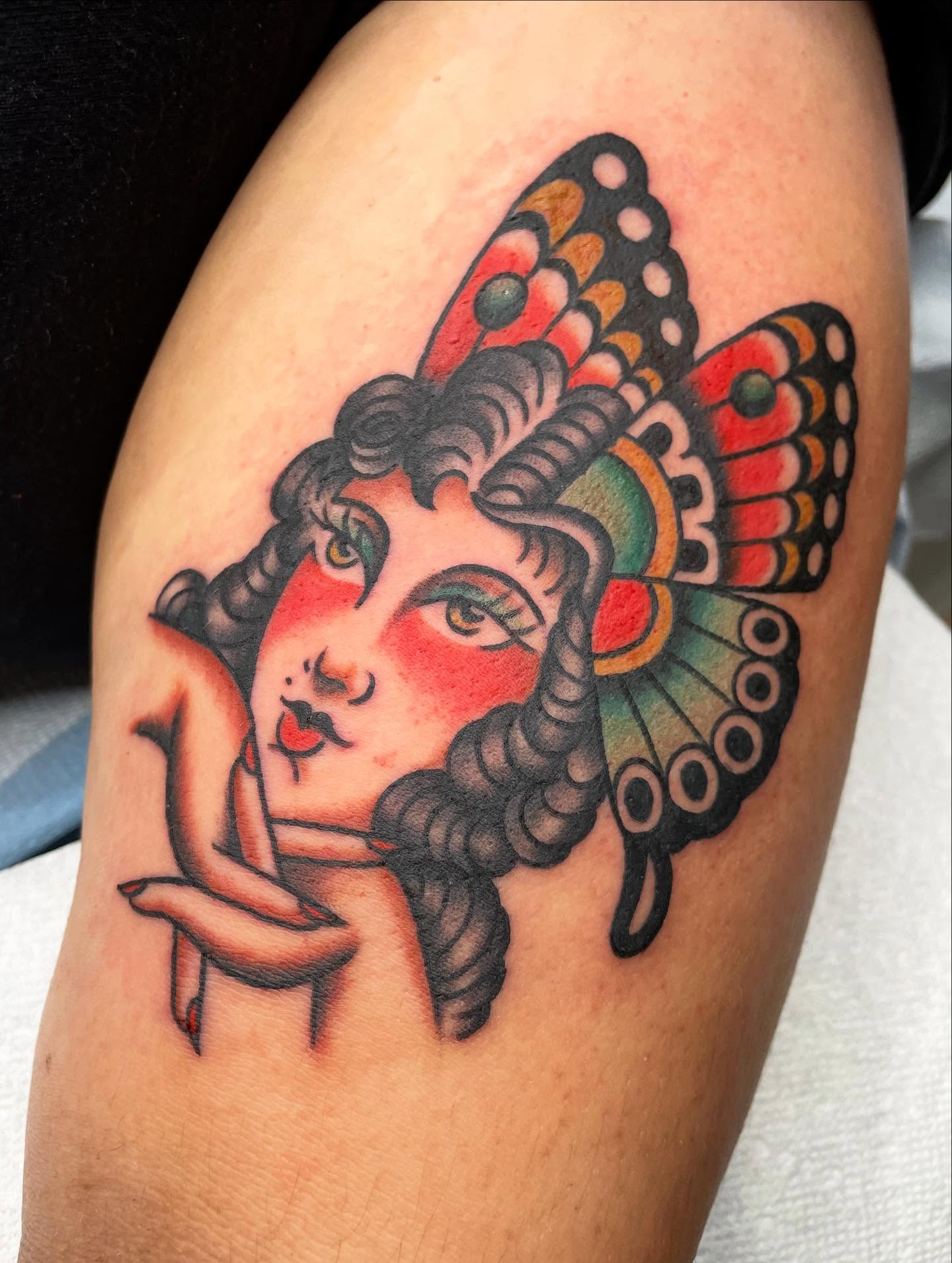 Woman with horns American traditional tattoo on the thigh by Kat, Sacramento, California