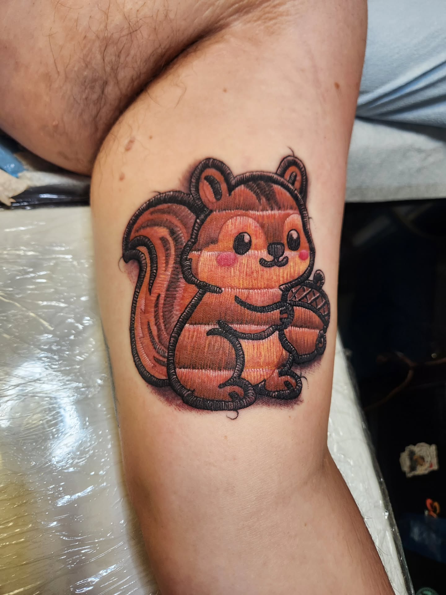 Squirrel dotwork tattoo on the forearm by Chris Bowen