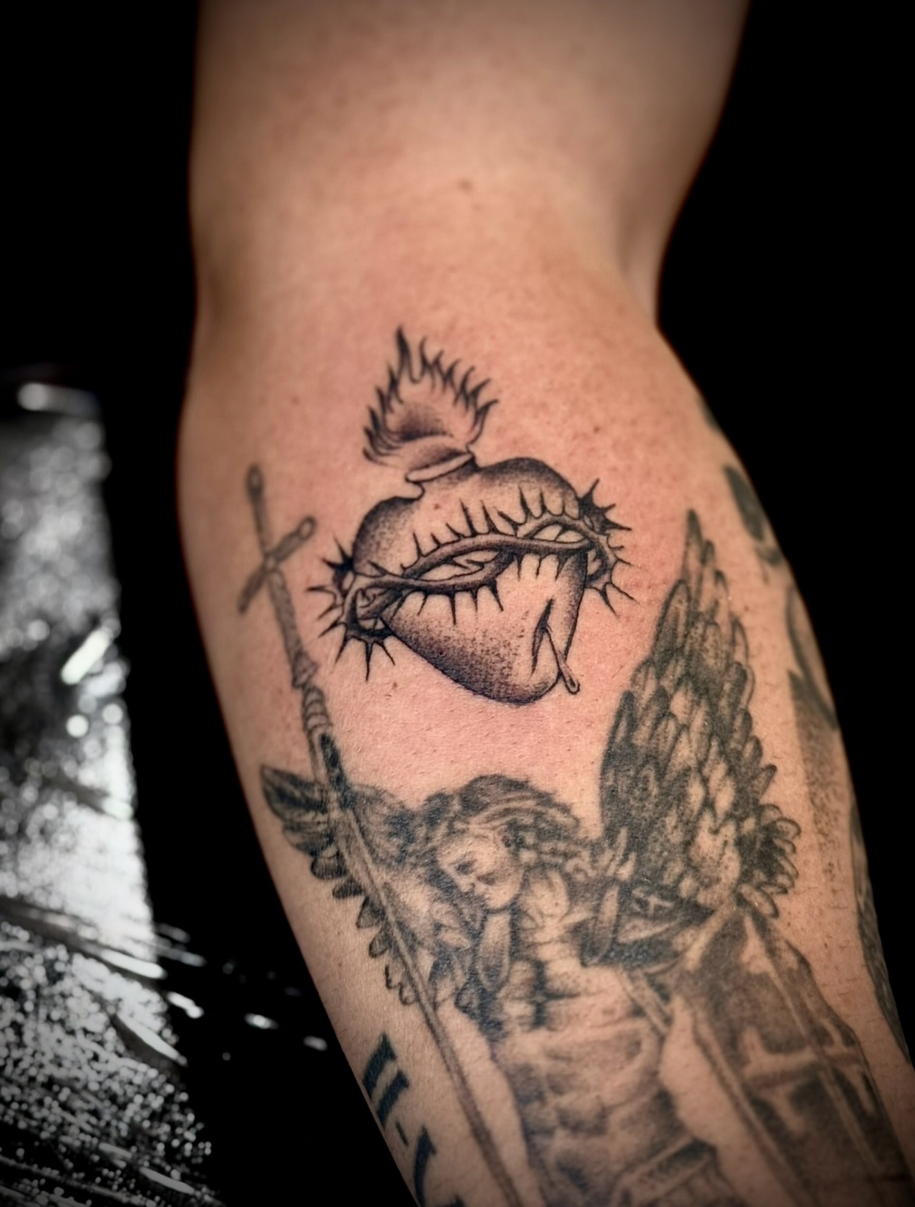 Heart with thorns realism tattoo on the forearm by Thomas Martinez