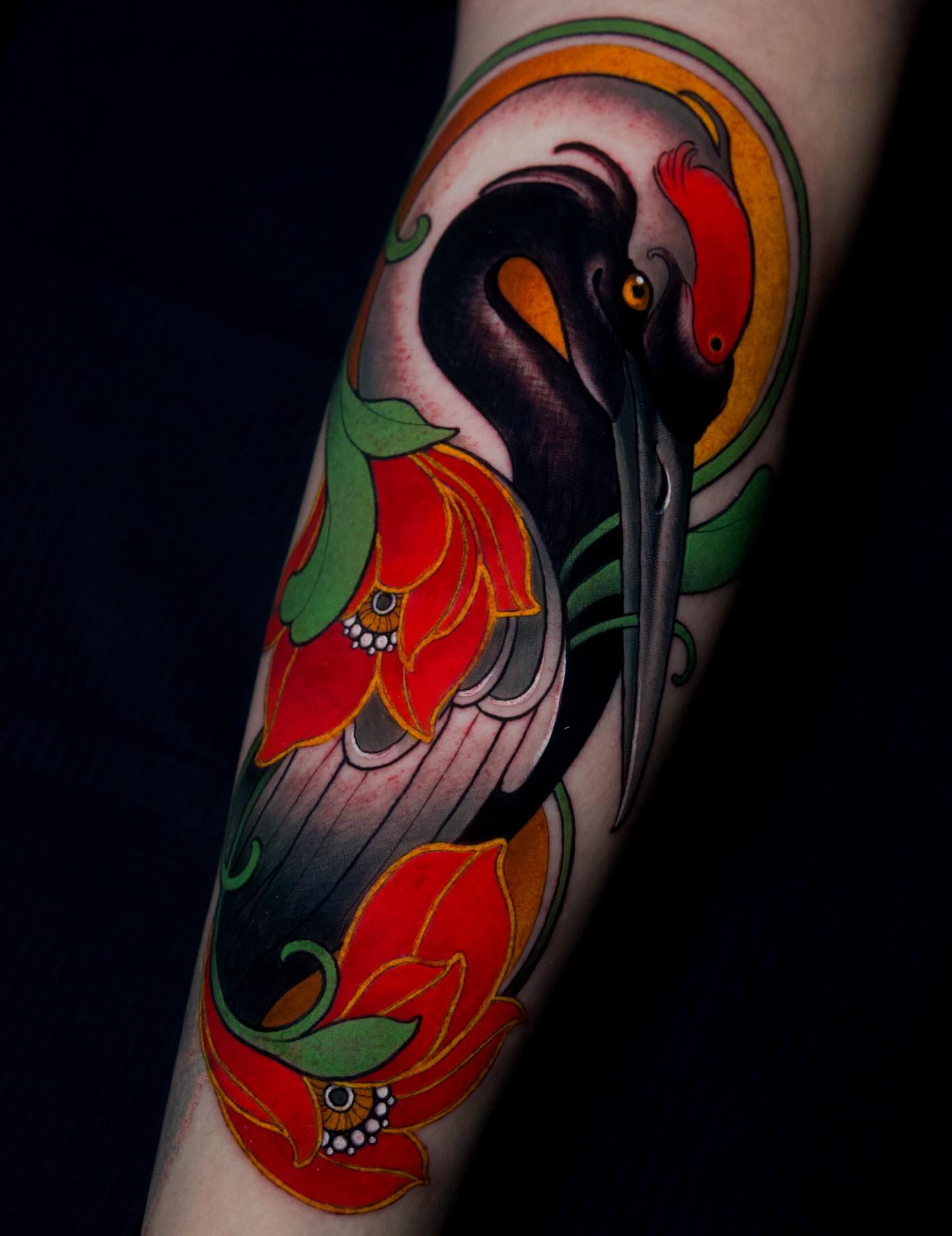 Heron and lotus American traditional tattoo on the forearm by π·πΉππππ π²πππππ·