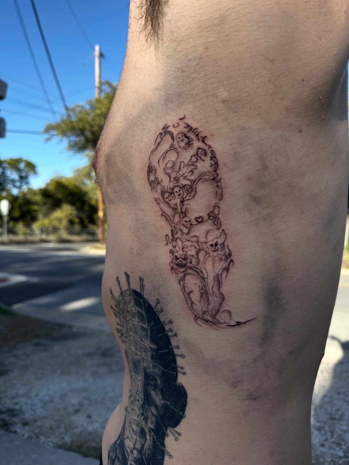 Spiritual entities black and grey tattoo on the thigh by Swag Originator