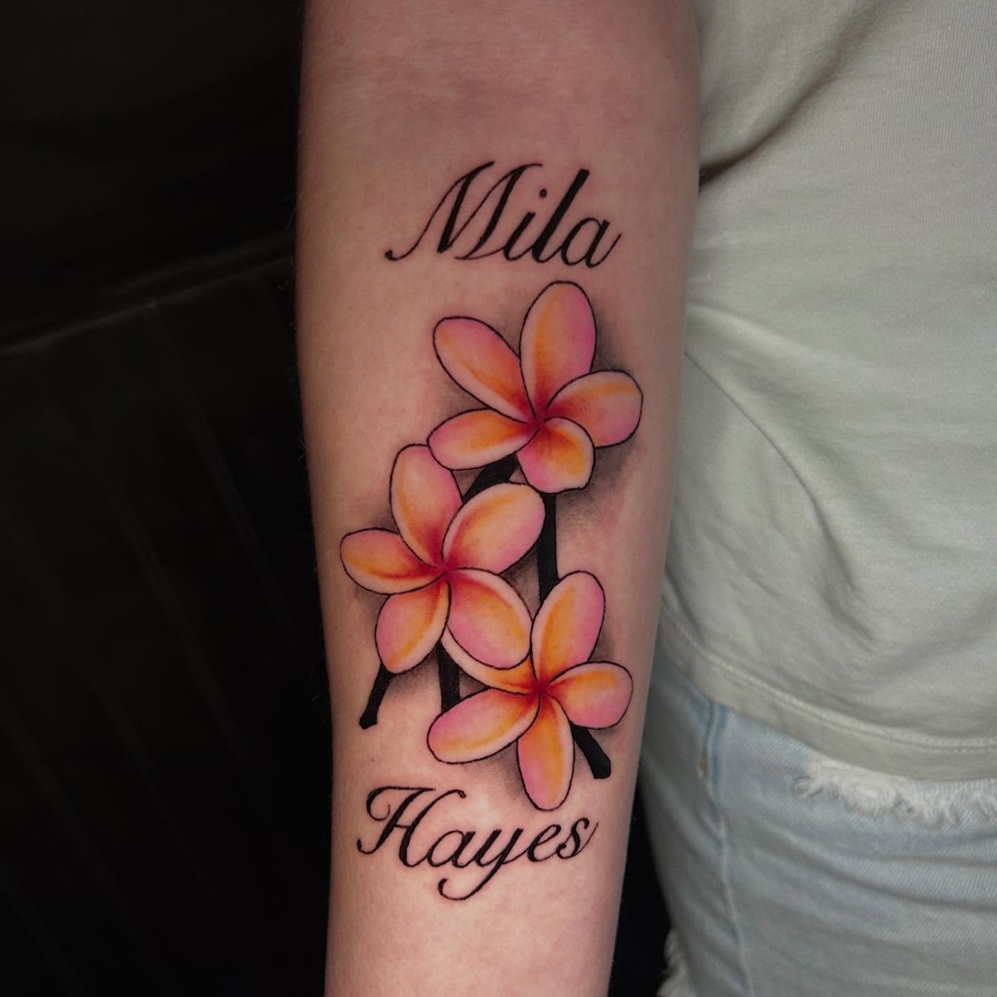 Plumeria flowers realism tattoo on the forearm by Devon