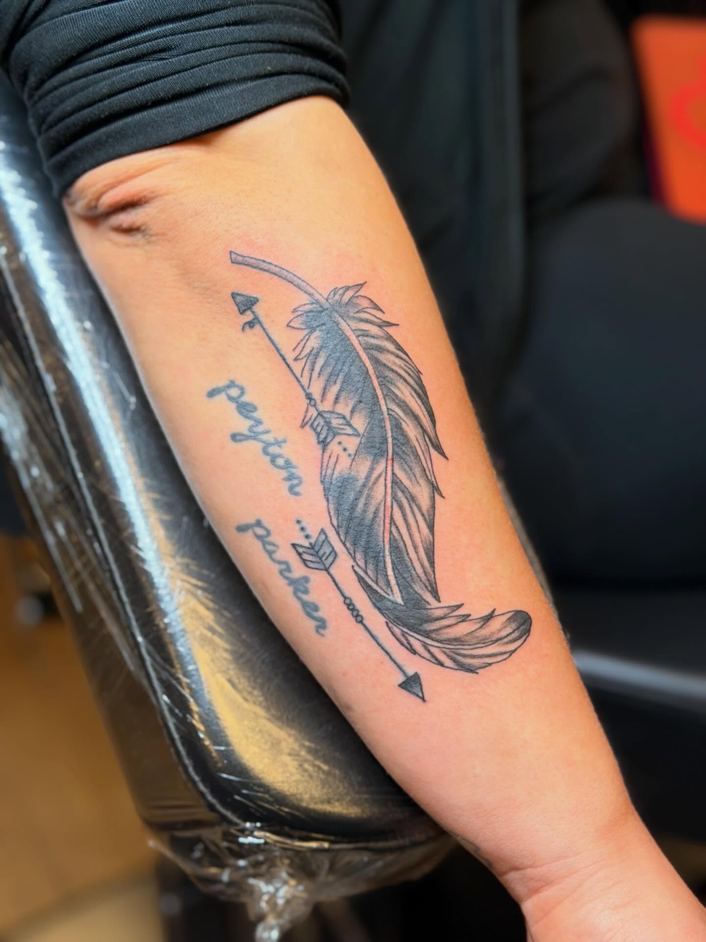Feather and arrow black and grey tattoo on the forearm by Joshua Ware, Alvarado, Texas