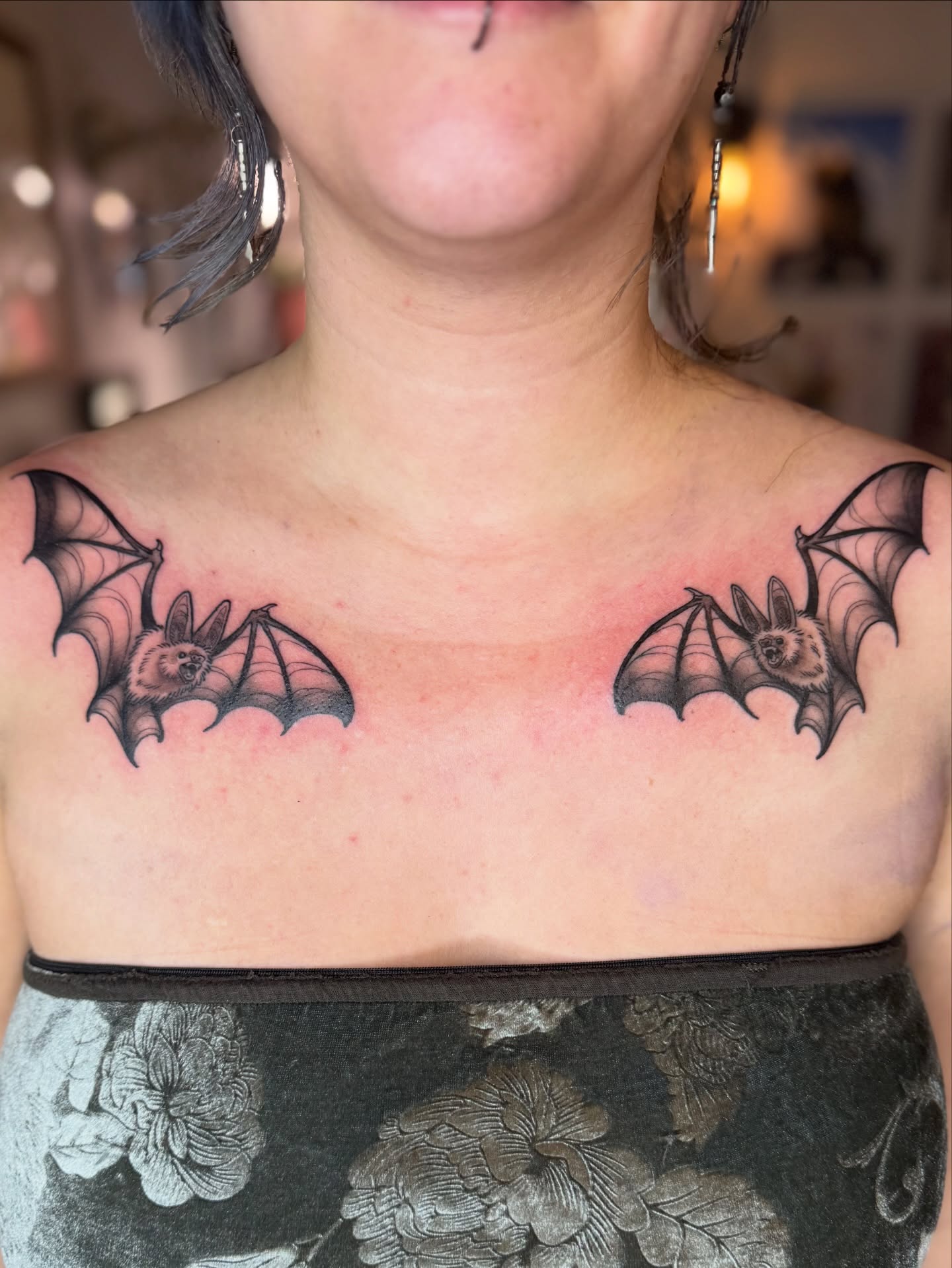 Bat black and grey tattoo on the chest by Erin Bratzler