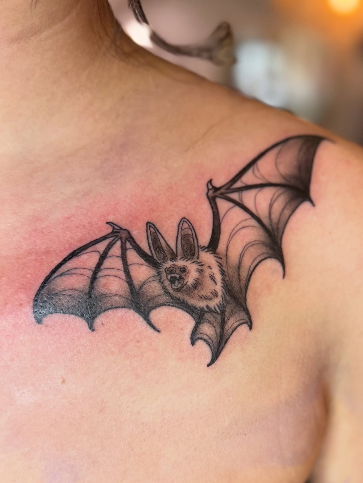 Bat realism tattoo on the shoulder by Erin Bratzler