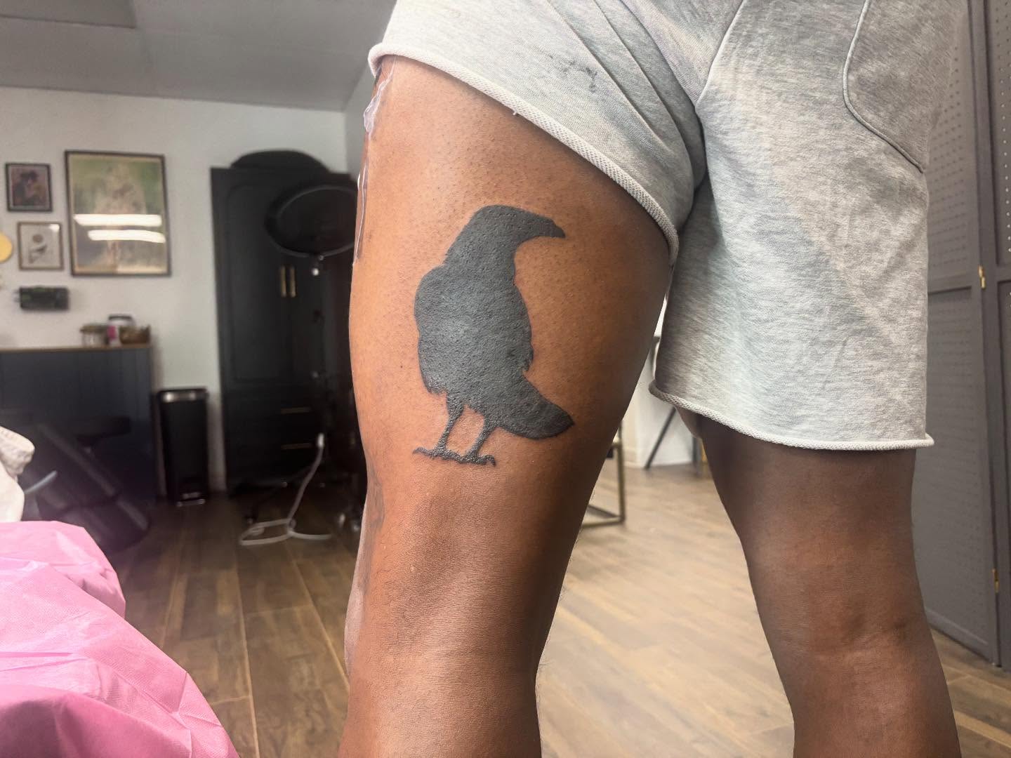 Crow black and grey tattoo on the thigh by Mickey