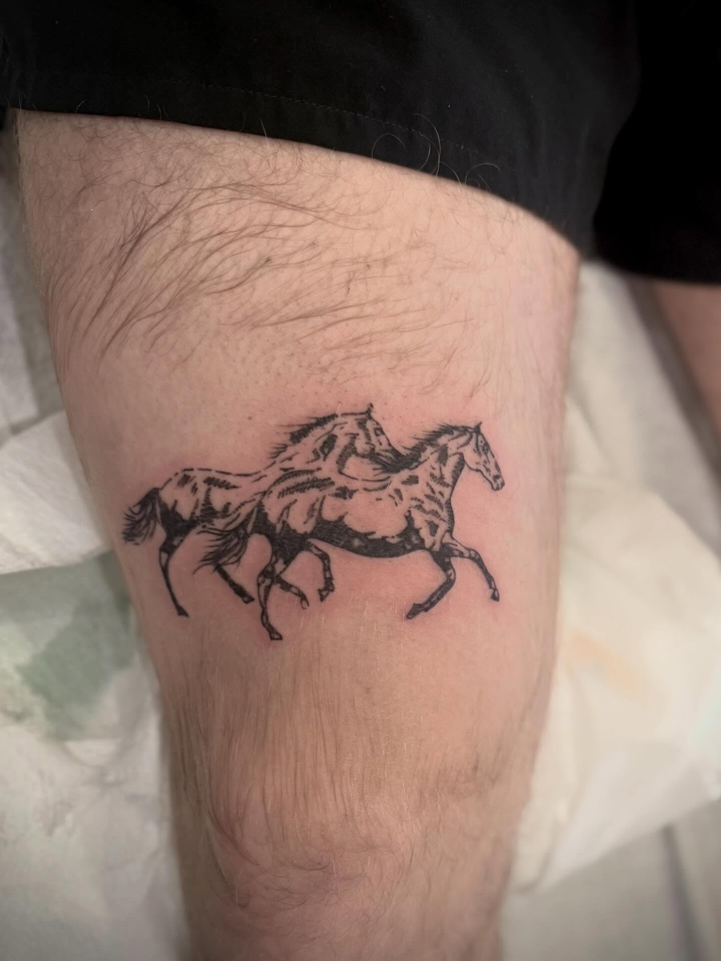 Horses black and grey tattoo on the thigh by Daniel Anthony, Philadelphia, Pennsylvania