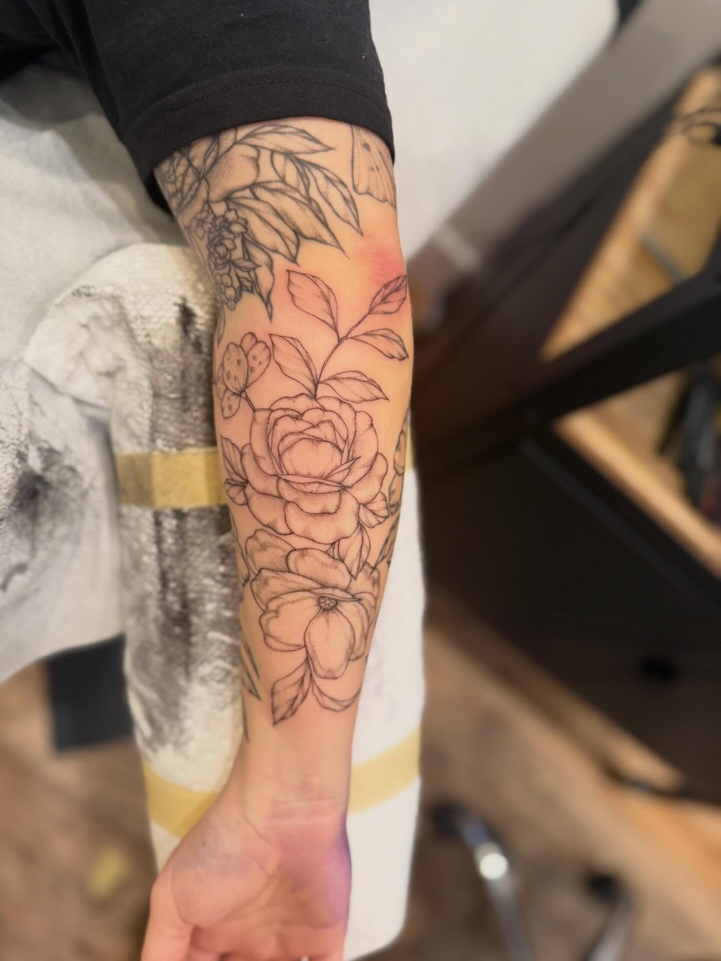 Floral bouquet black and grey tattoo on the forearm by Daniel Anthony, Philadelphia, Pennsylvania