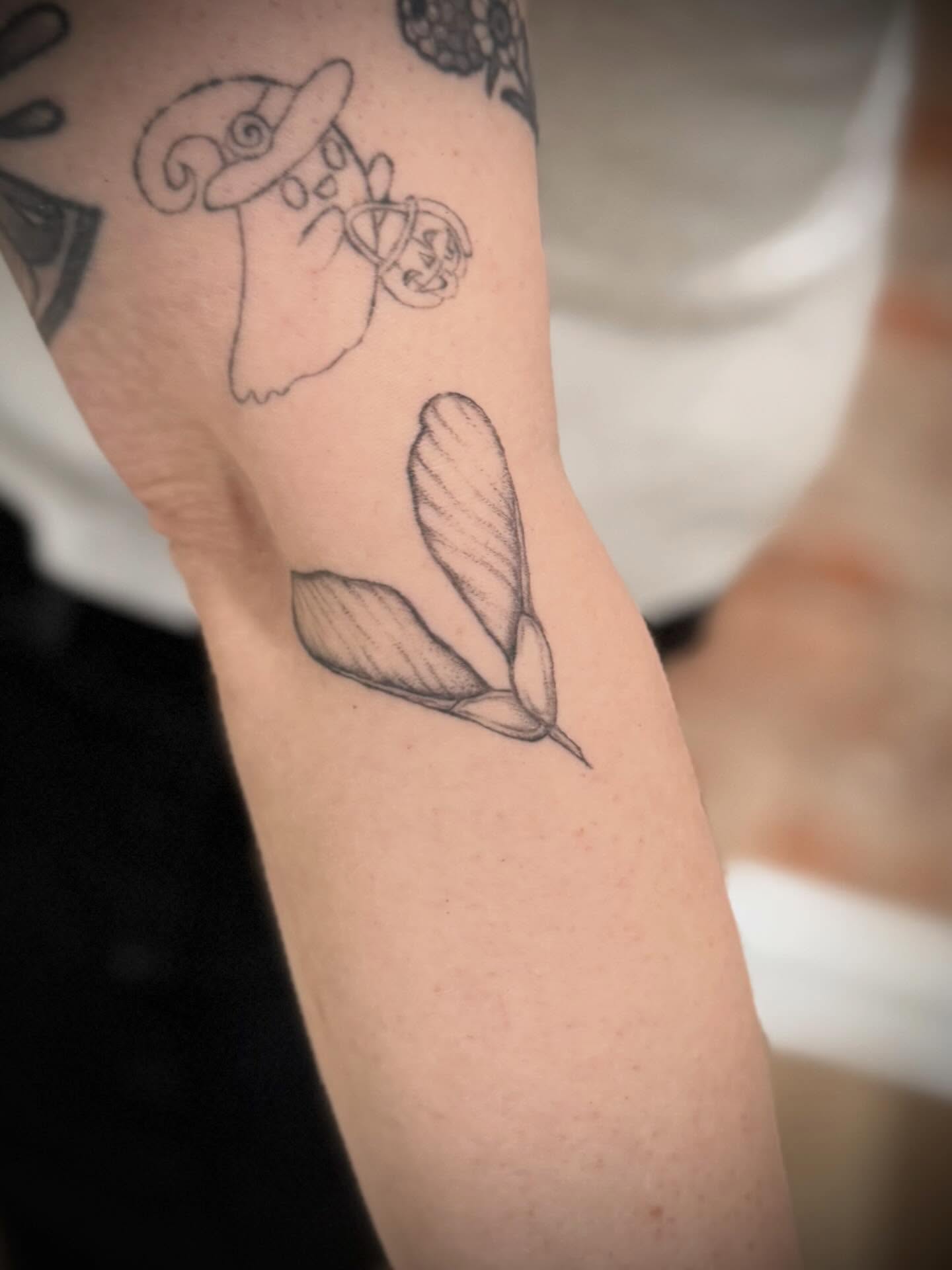 Maple seeds black and grey tattoo on the forearm by Daniel Anthony, Philadelphia, Pennsylvania