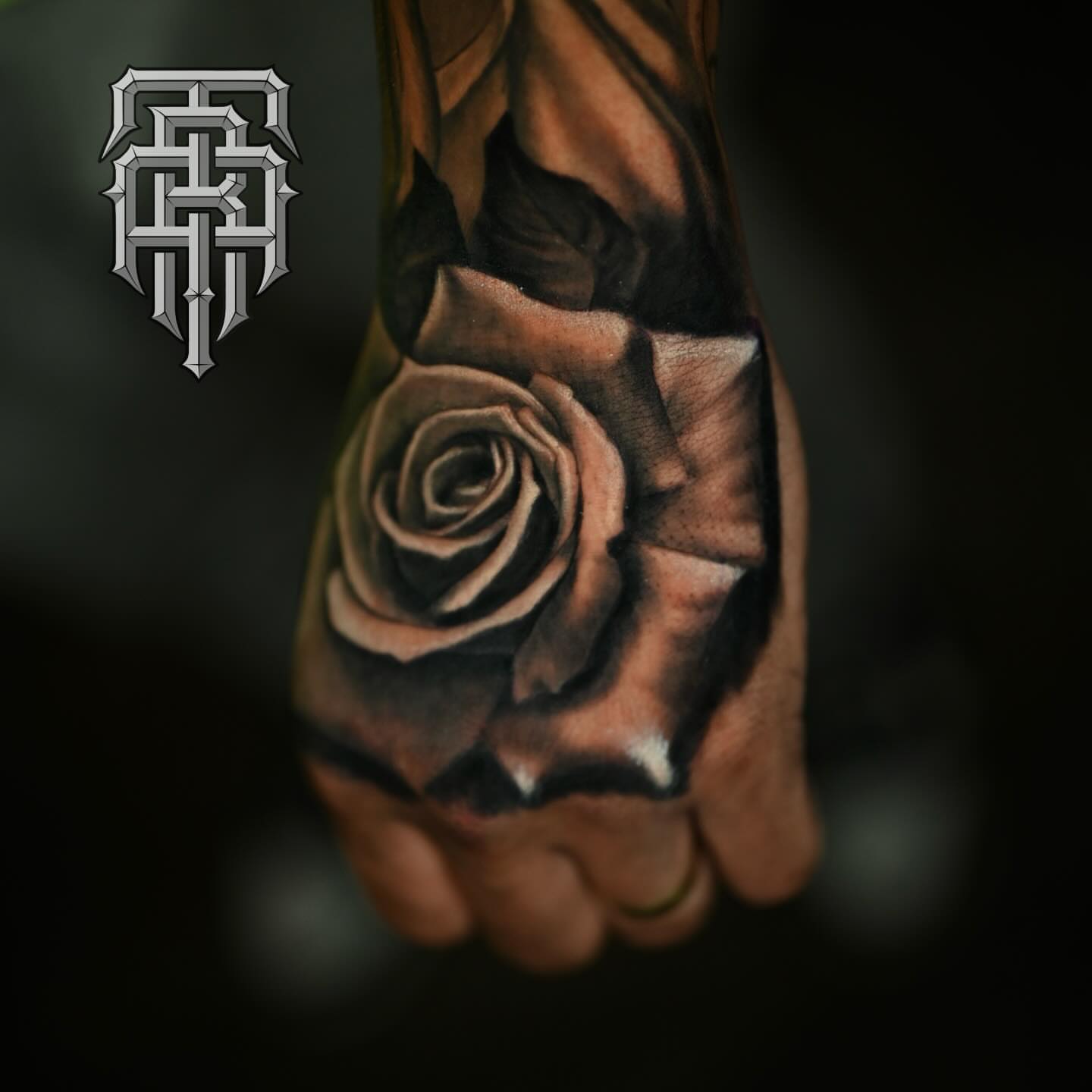 Rose realism tattoo on the hand by Art Lopez