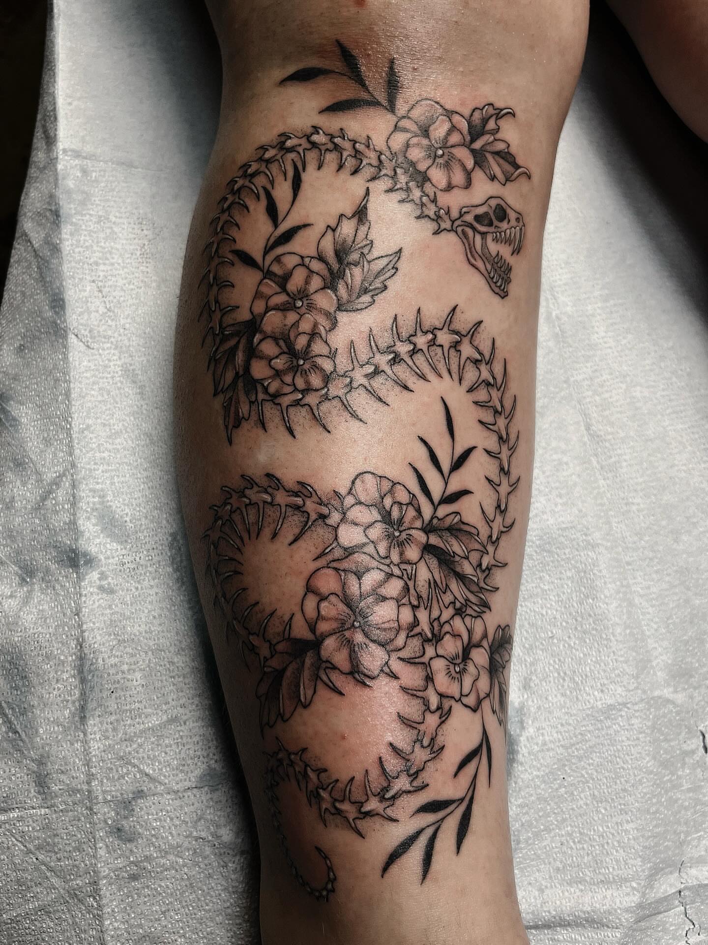 Snake and flowers black and grey tattoo on the forearm by β
πΈππππ β