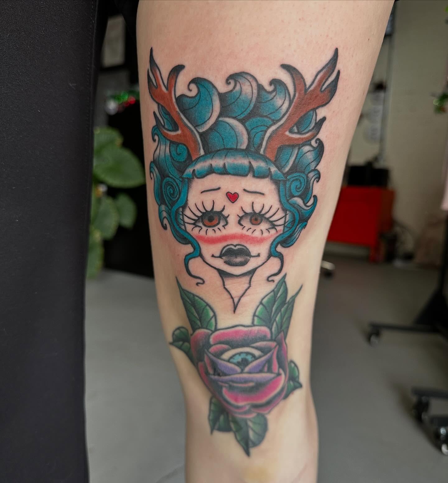 Deer-headed woman with rose American traditional tattoo on the forearm by HannaH