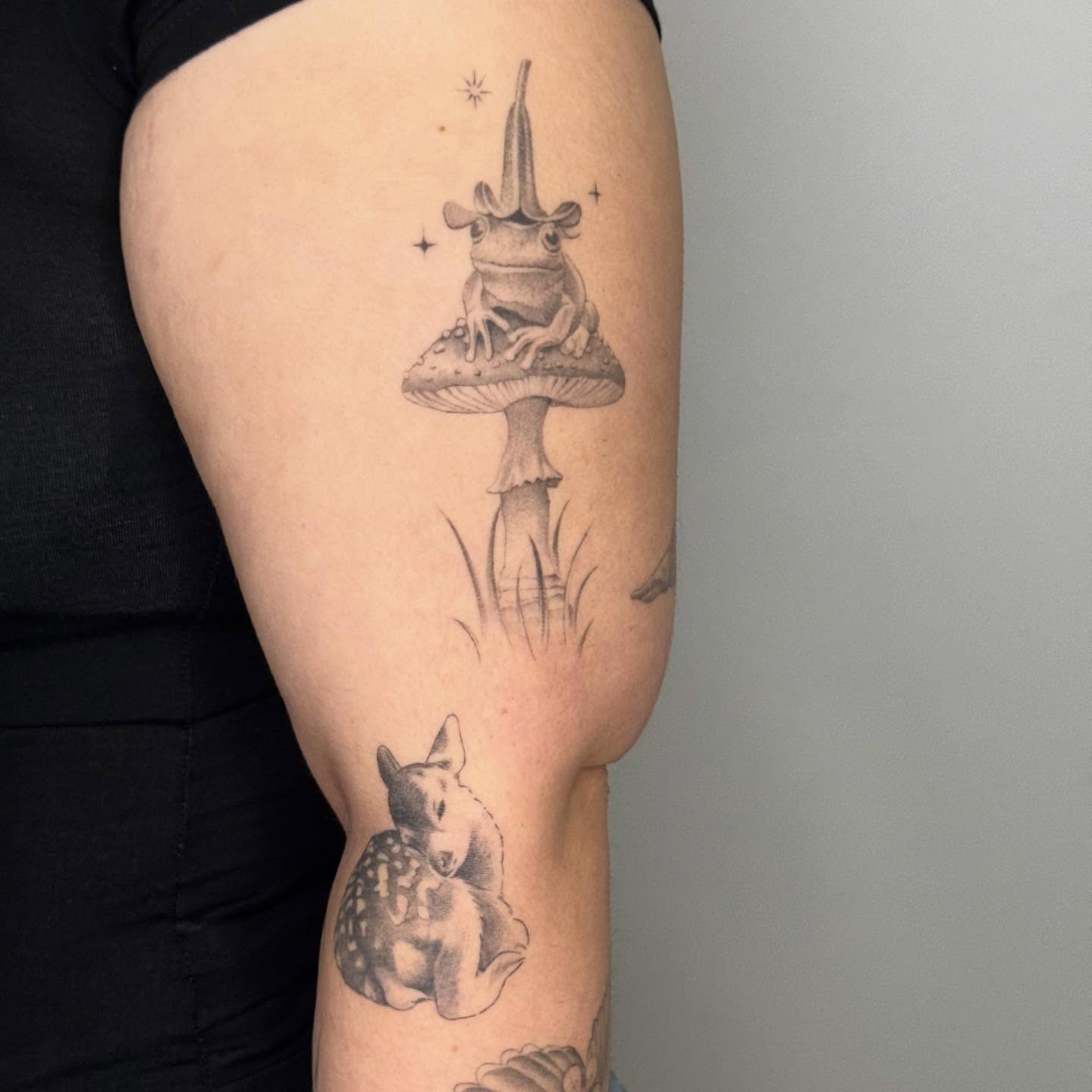 Frog on mushroom black and grey tattoo on the forearm by Alyssa . Villela