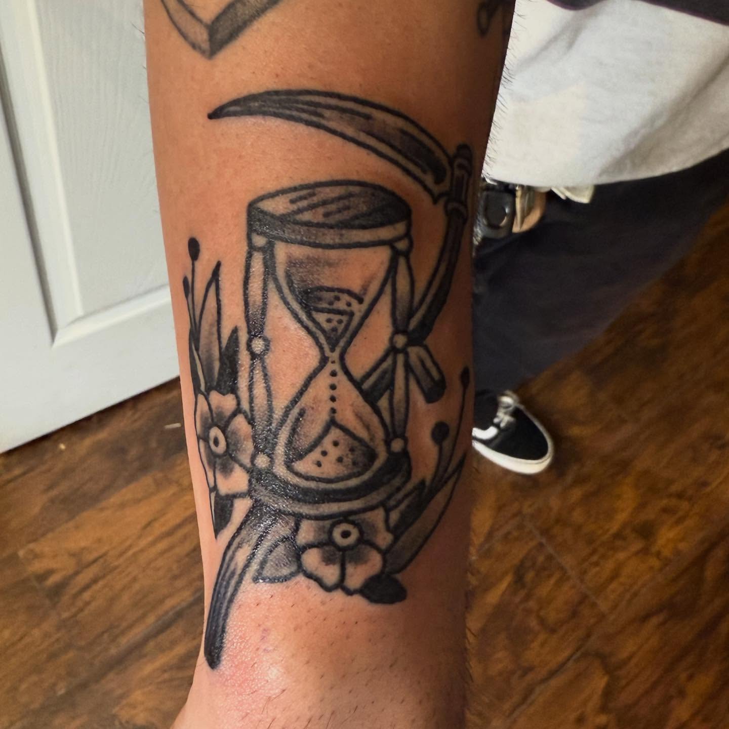 Hourglass dotwork tattoo on the forearm by Joe Truck