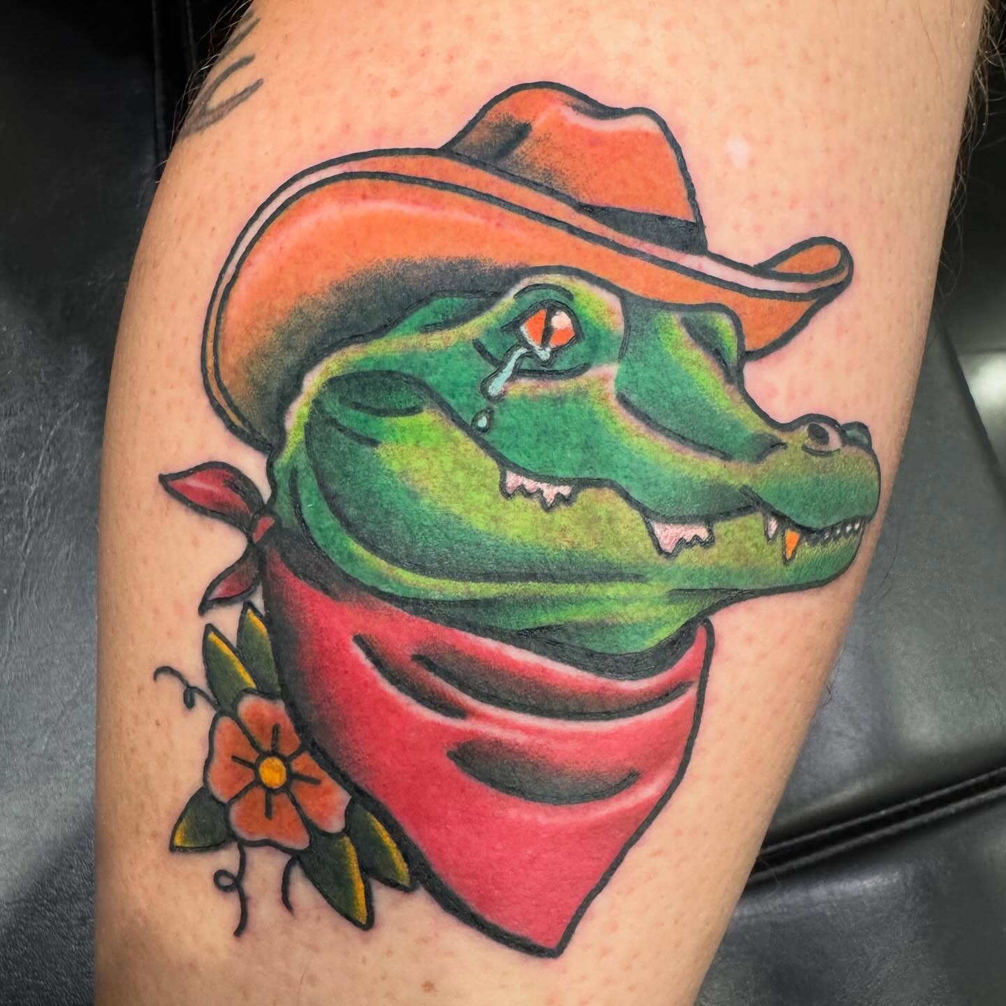 Alligator wearing cowboy hat and bandana American traditional tattoo on the thigh by Brian Herrera