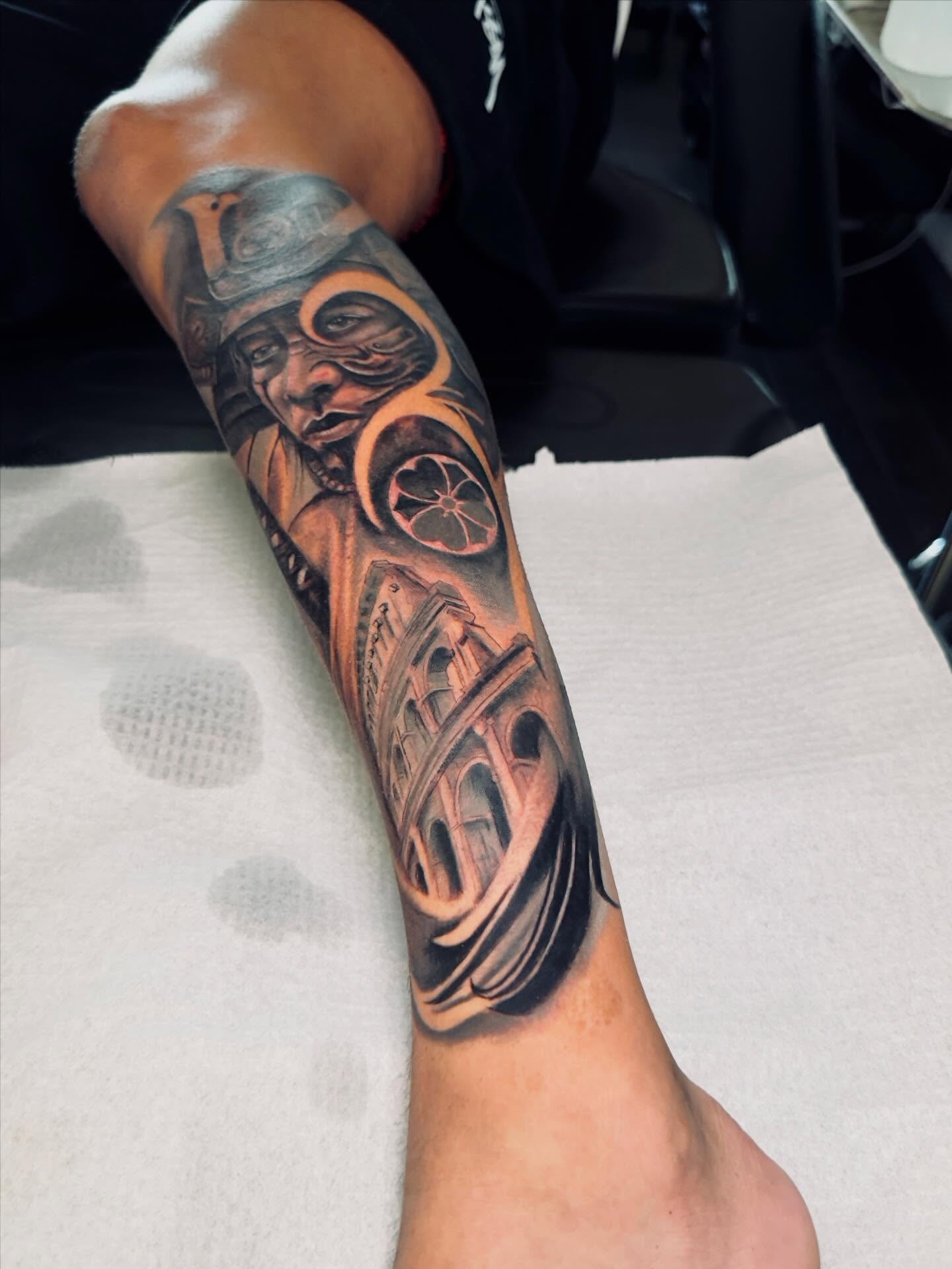 Roman soldier and colosseum realism tattoo on the forearm by Levi Tattoo Artist, Utah