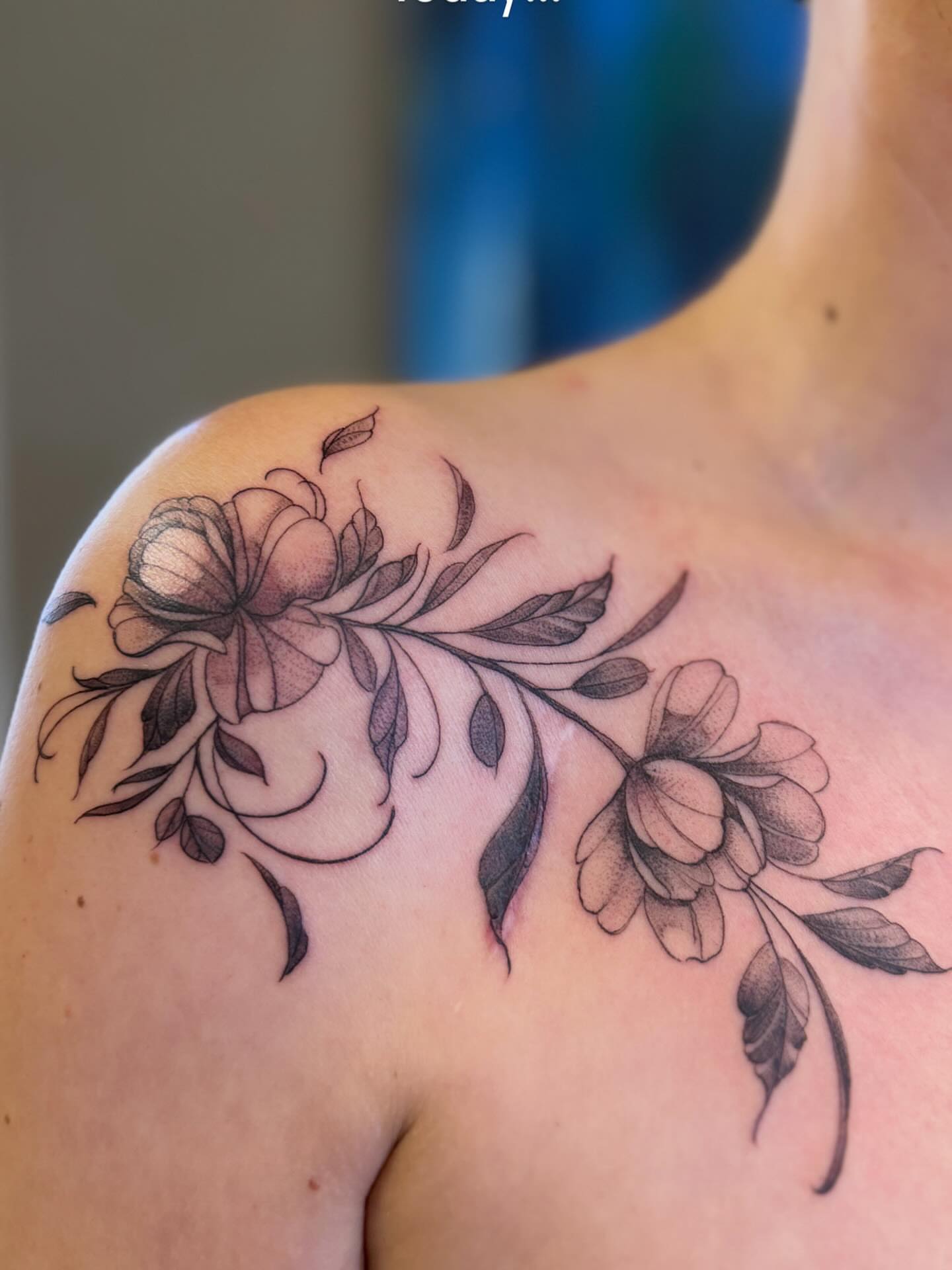 Floral arrangement black and grey tattoo on the shoulder by Die Ivo, Bielefeld, Germany