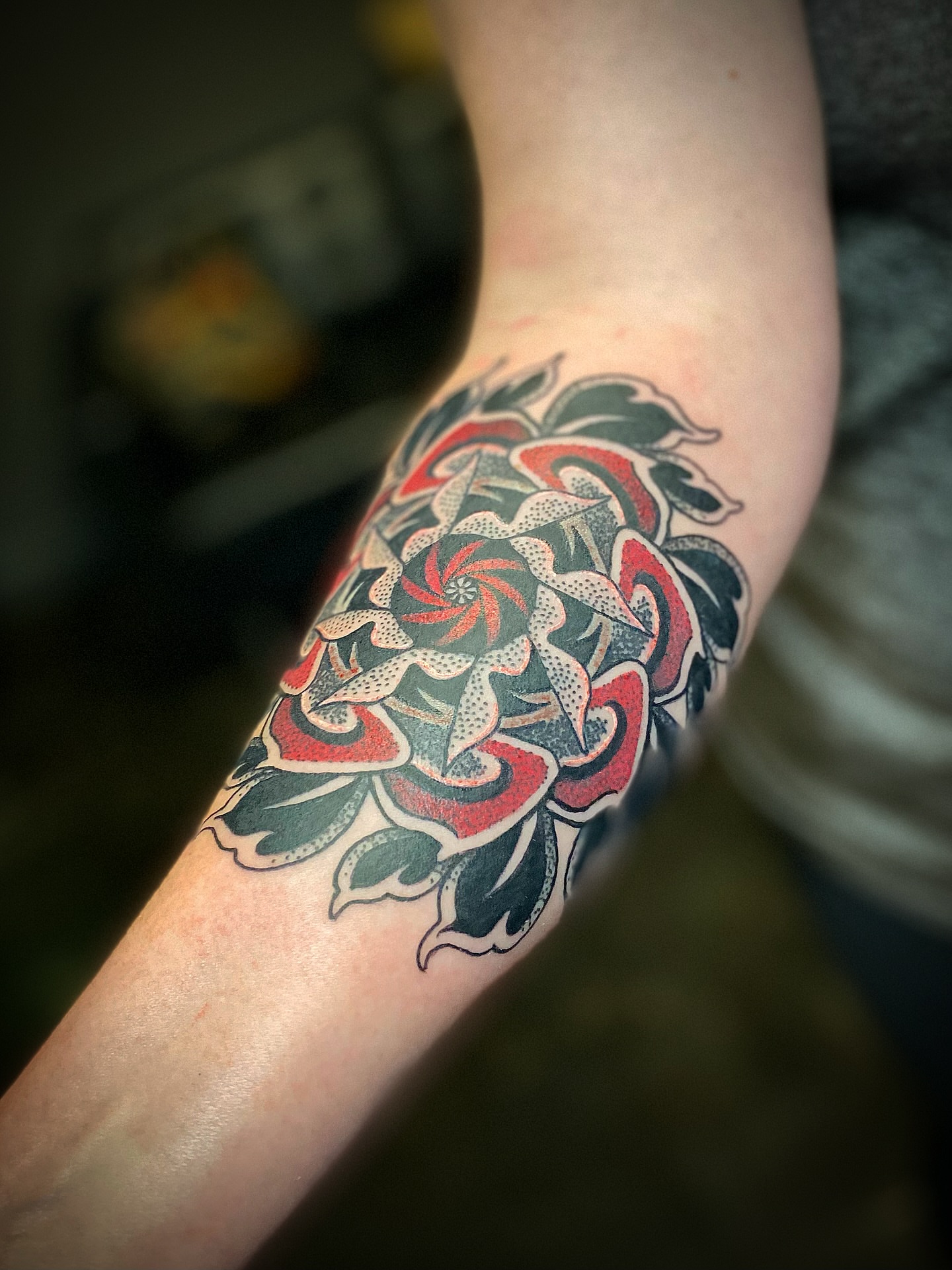Floral mandala dotwork tattoo on the forearm by Josh St.germain