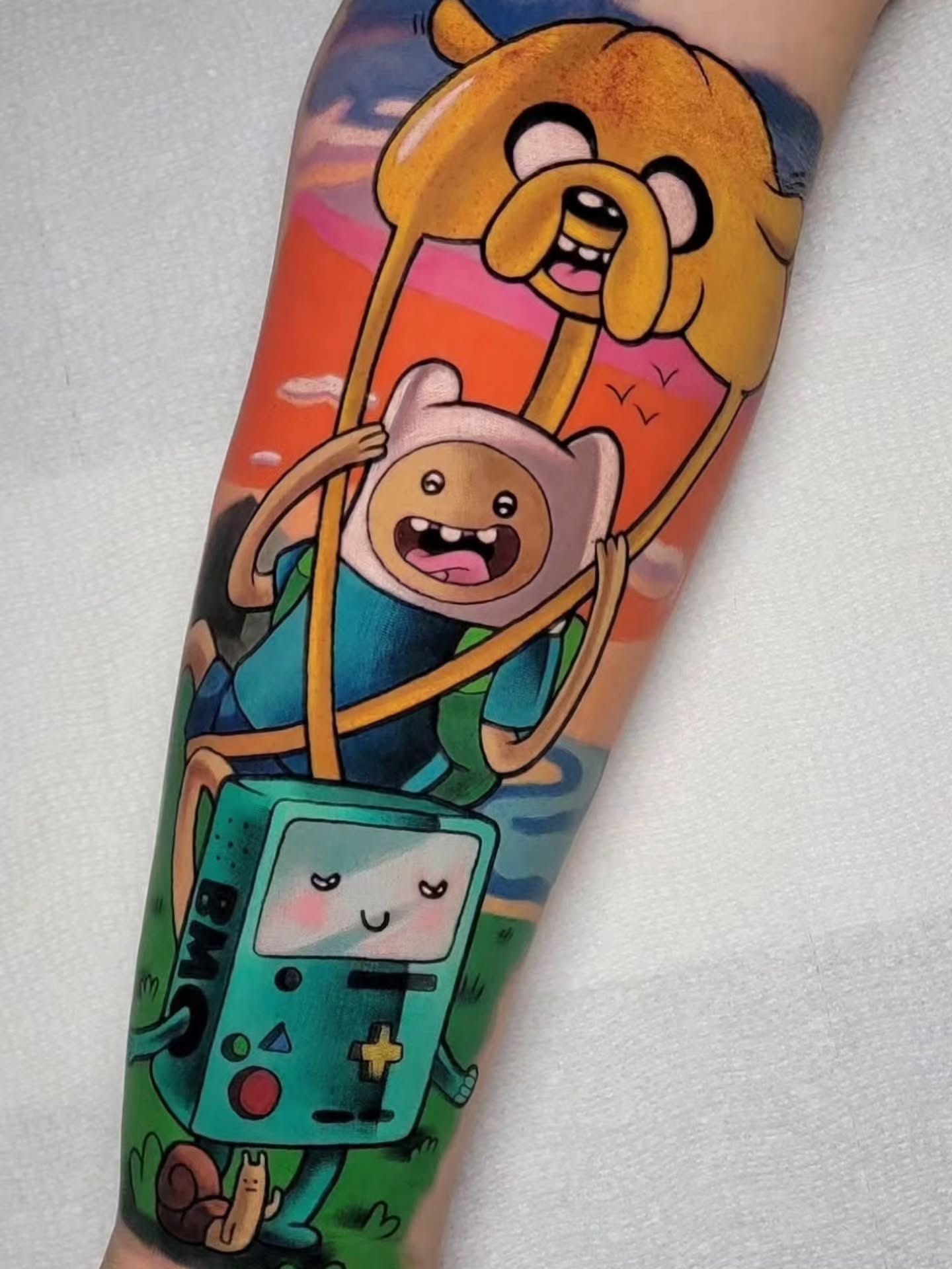 Adventure Time characters dotwork tattoo on the forearm by Melissa Does Tattoos - Bright, Bold Anime &