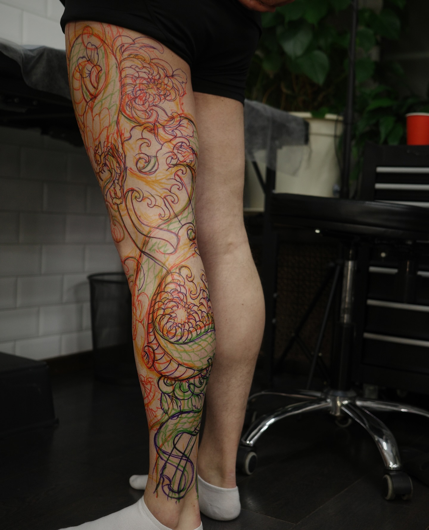 Floral design new school tattoo on the calf by Innokenty Meshchakov, Portland, Oregon