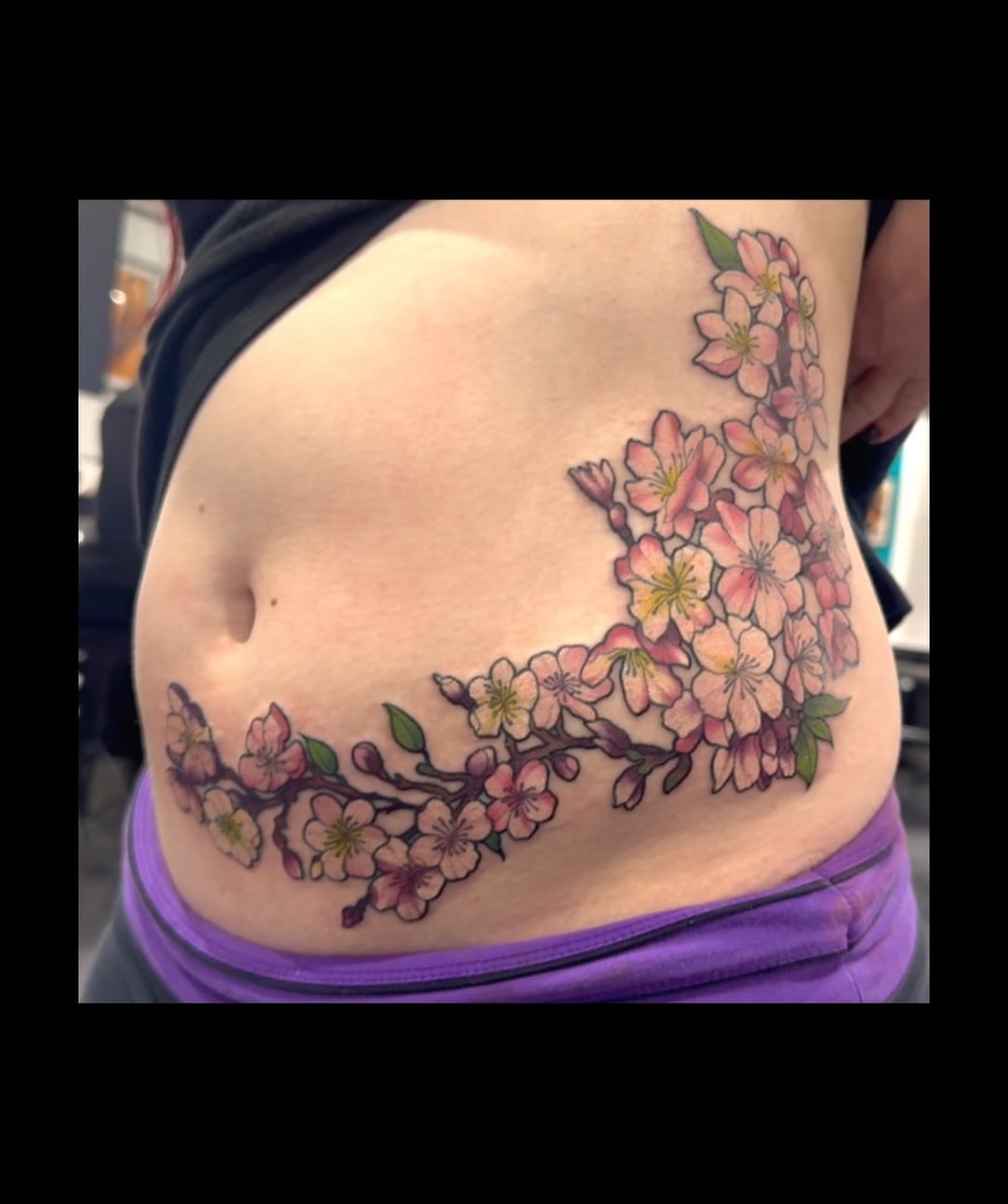 Cherry blossoms new school tattoo on the torso by Hannah Casadonti