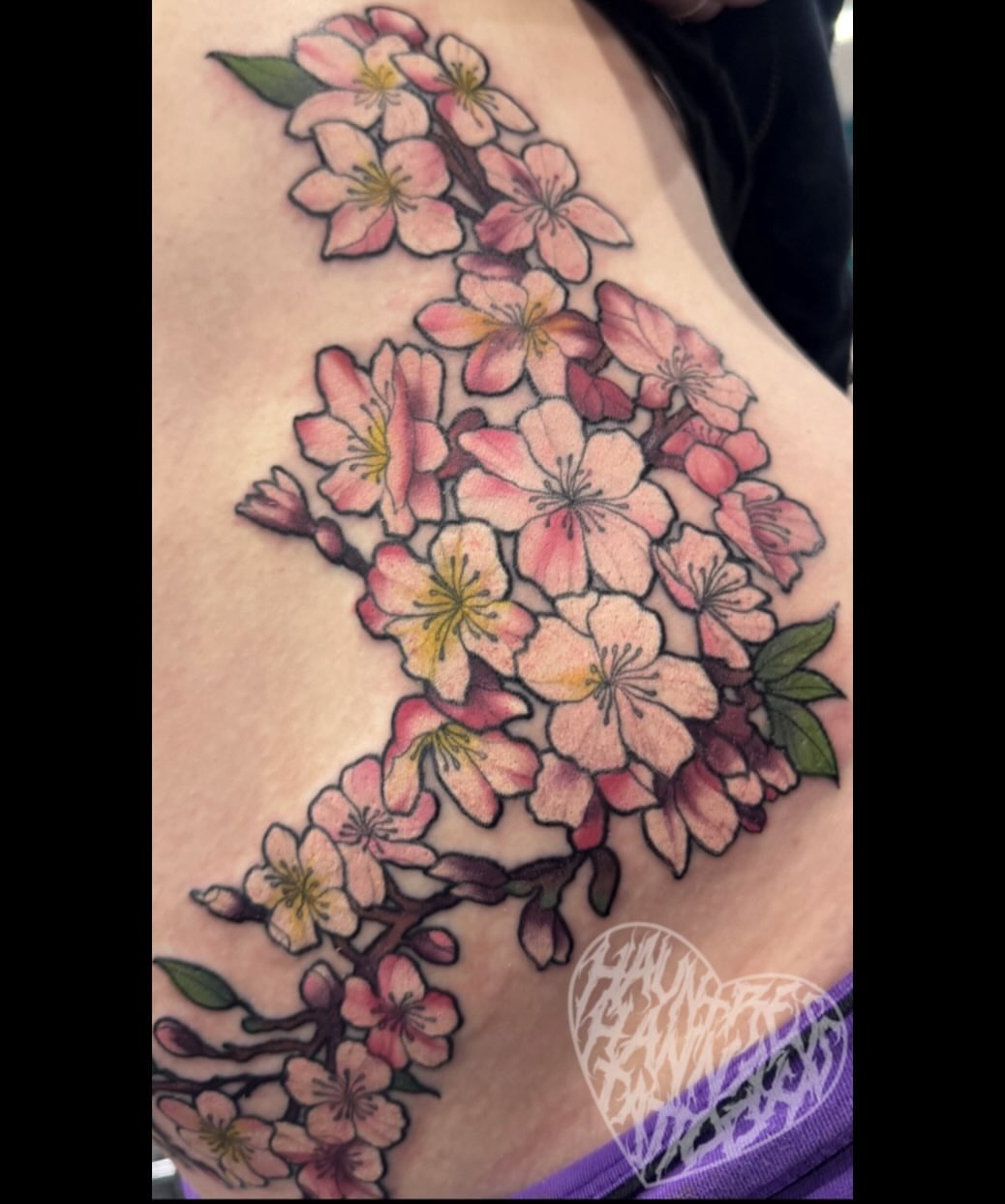Cherry blossoms watercolor tattoo on the shoulder by Hannah Casadonti
