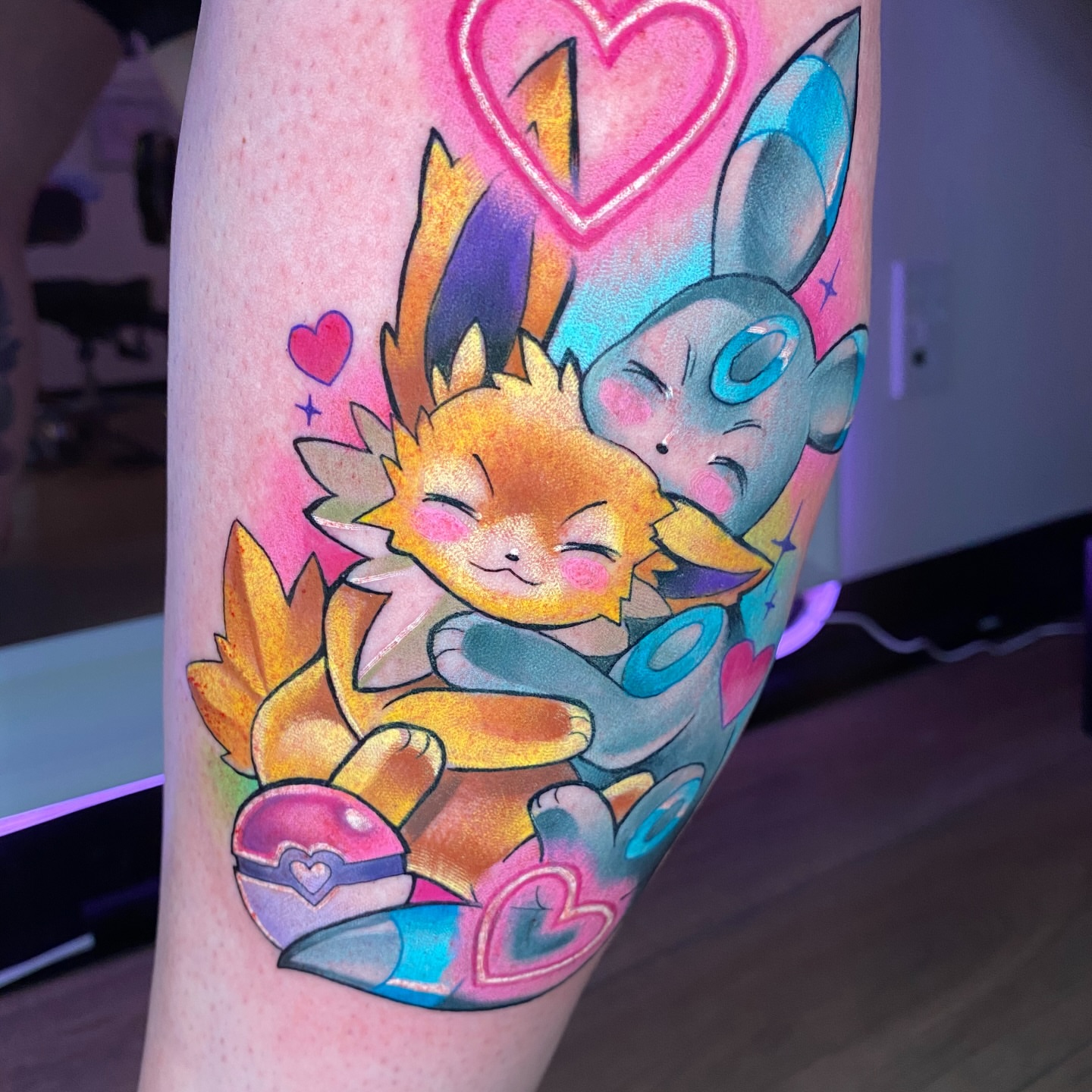 Riolu and Jolteon dotwork tattoo on the forearm by Amy Porter