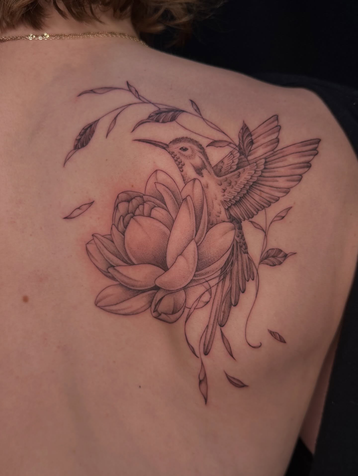 Bird and lotus realism tattoo on the shoulder by Hail Chaney, Somerville, Massachusetts