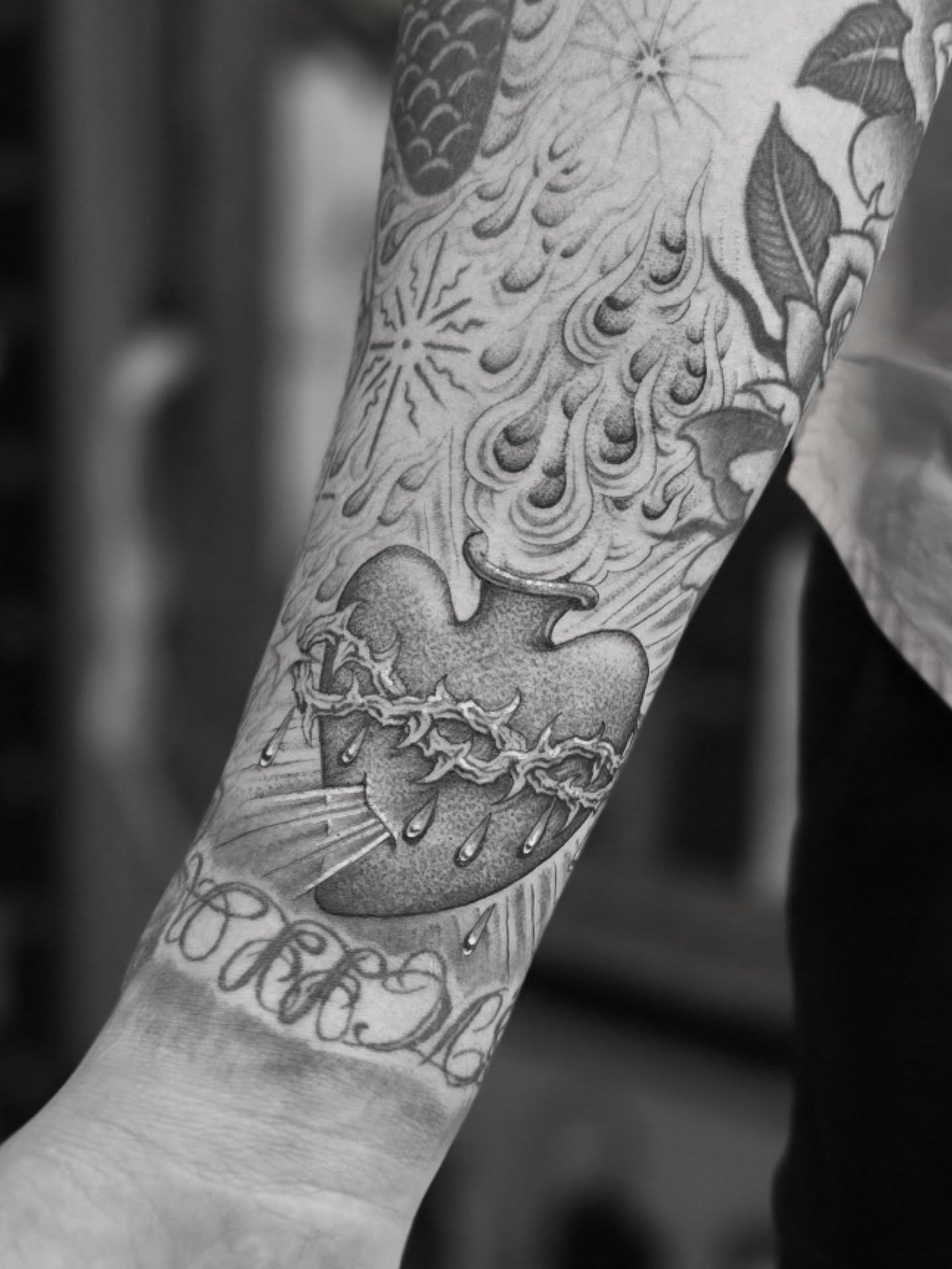 Heart with crown dotwork tattoo on the forearm by Aaron Dor