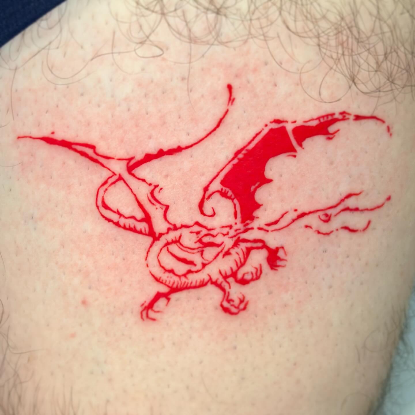 Dragon dotwork tattoo on the shoulder by Lex
