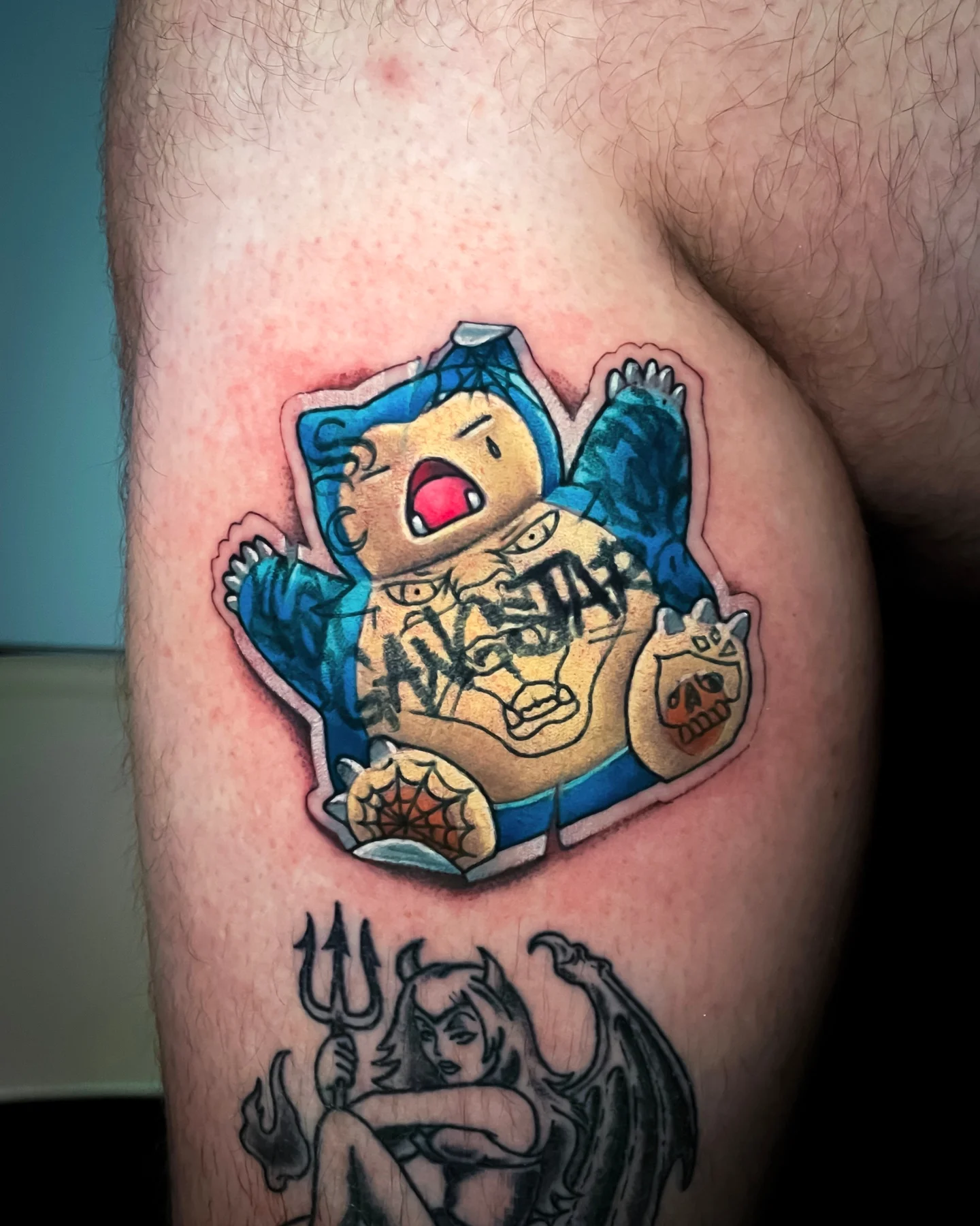 Cartoon character American traditional tattoo on the thigh by Tattoo artist in Seattle, WA