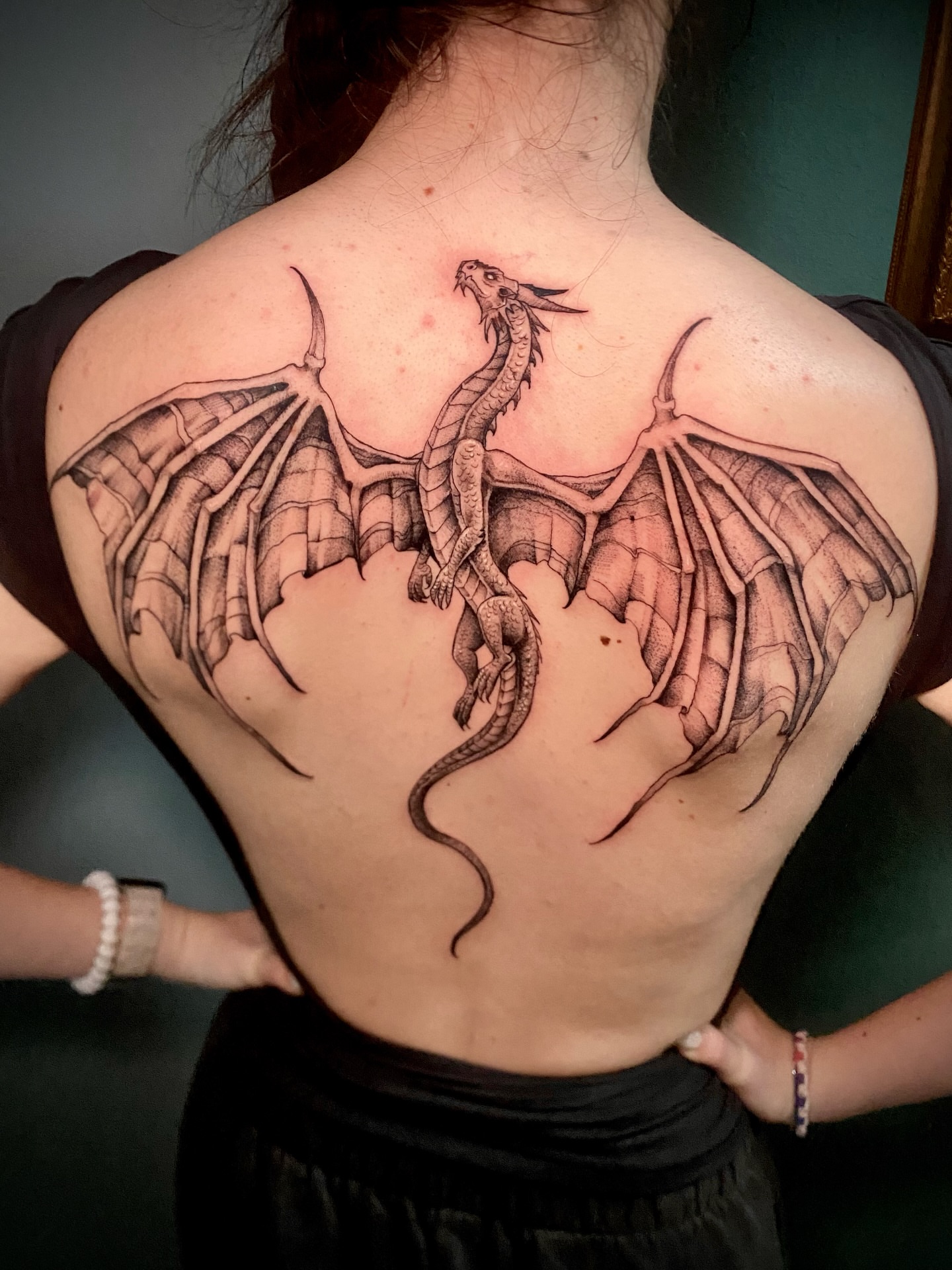 Dragon dotwork tattoo on the back by Adam Newton