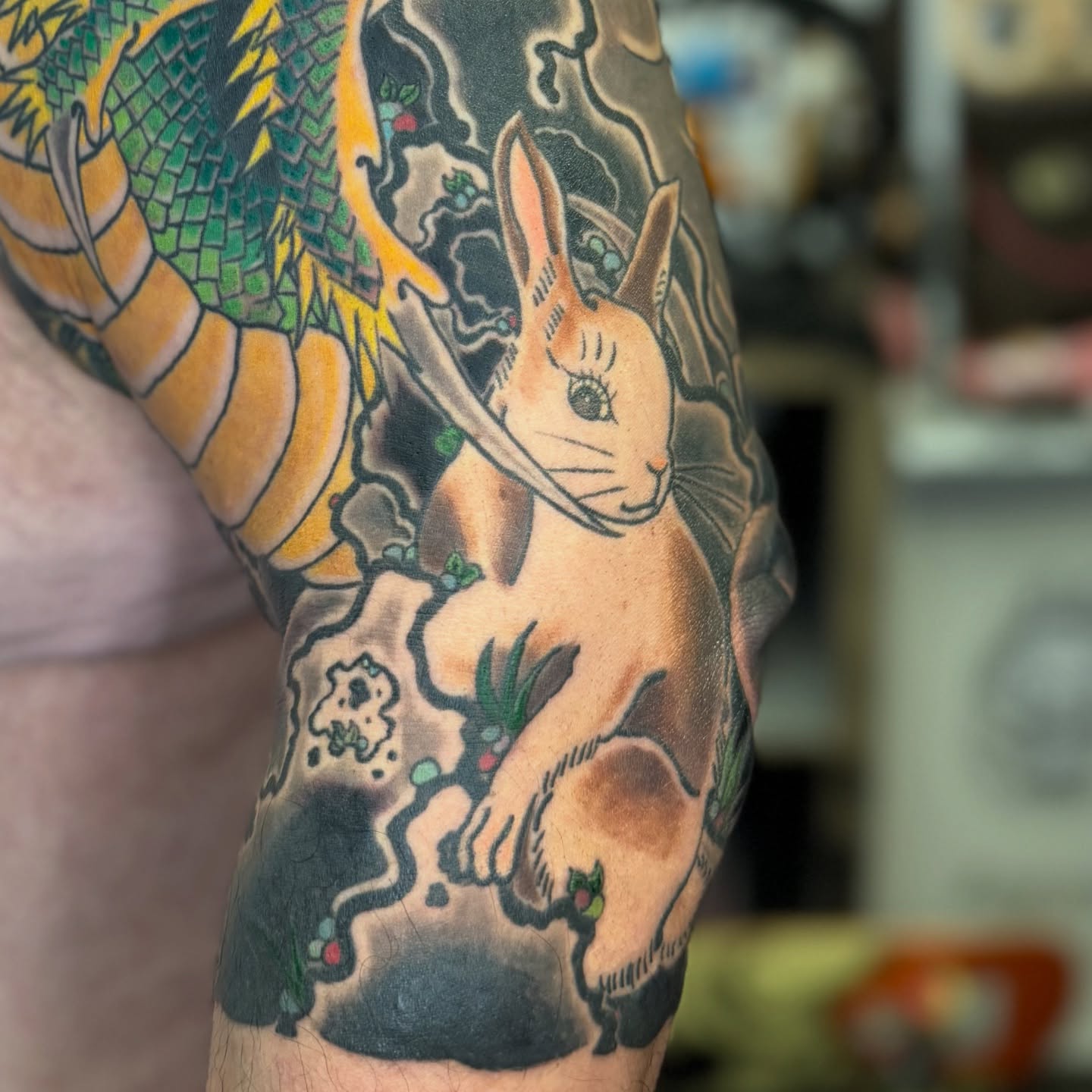 Rabbit and dragon American traditional tattoo on the forearm by Zack Yang, Houston, Texas
