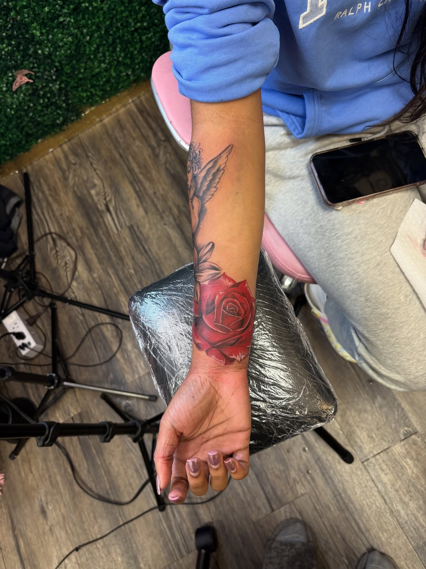 Red rose realism tattoo on the forearm by Bri Tatted That