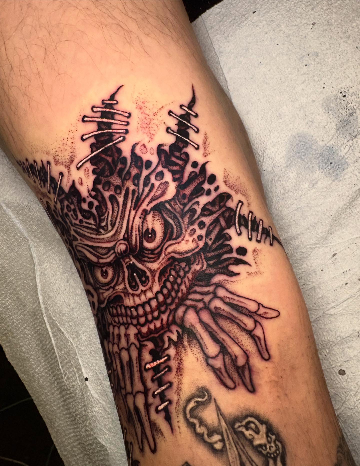 Skeleton with tentacles dark realism tattoo on the forearm by Brendan Smith