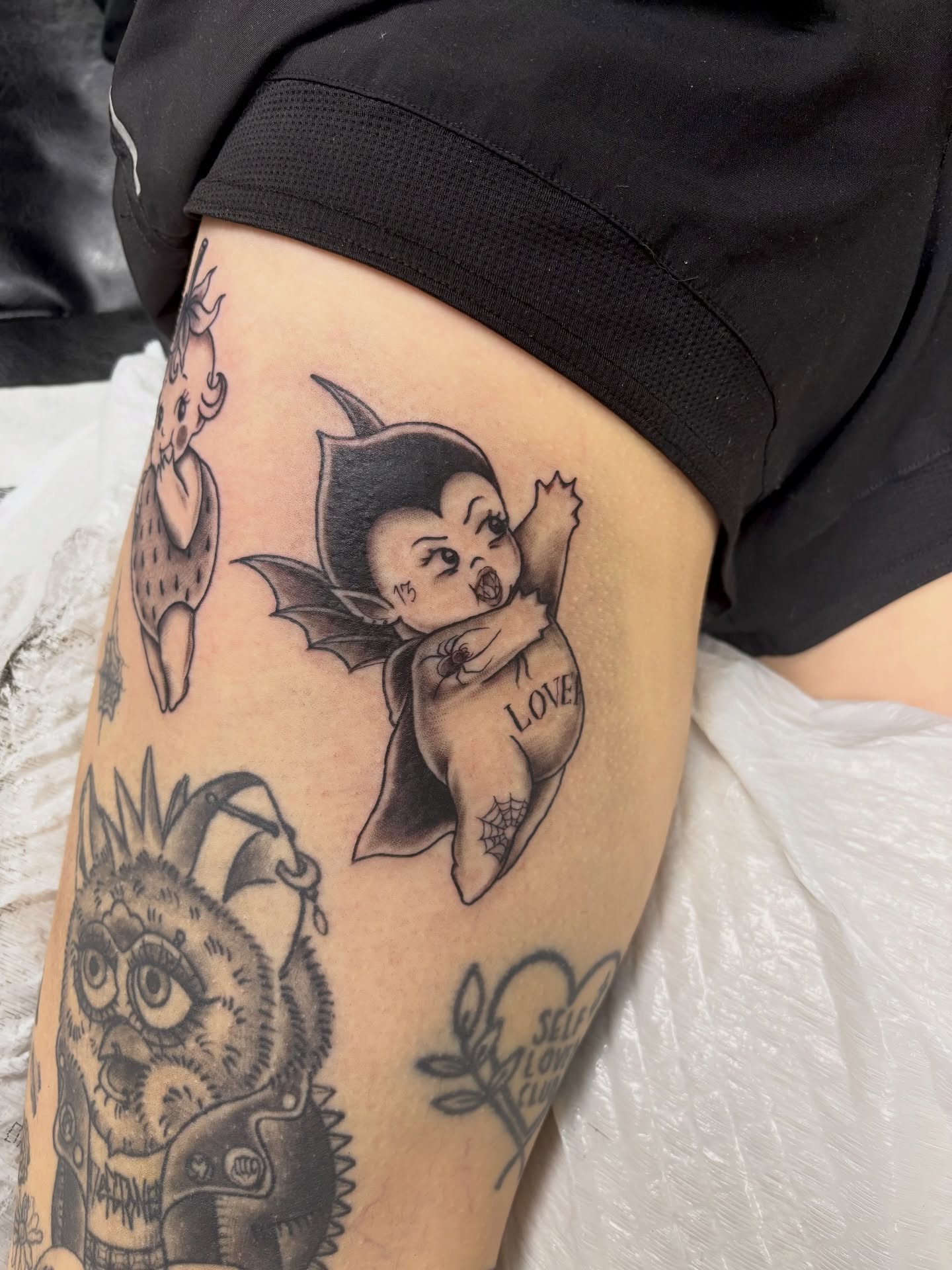 Bat baby American traditional tattoo on the thigh by sydney honn