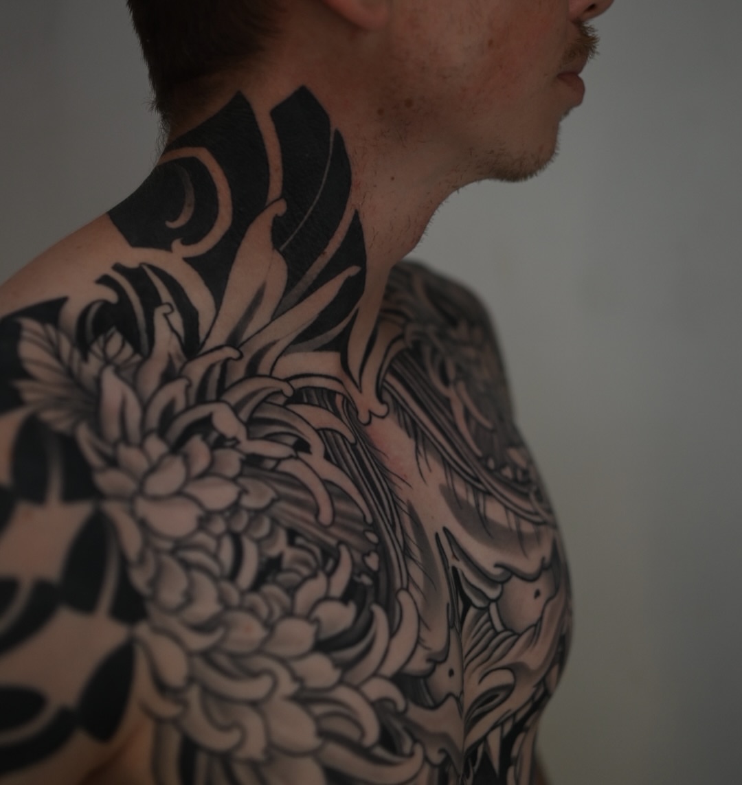 Chrysanthemum black and grey tattoo on the chest by Ryan Spencer - San Diego Tattoo Artist