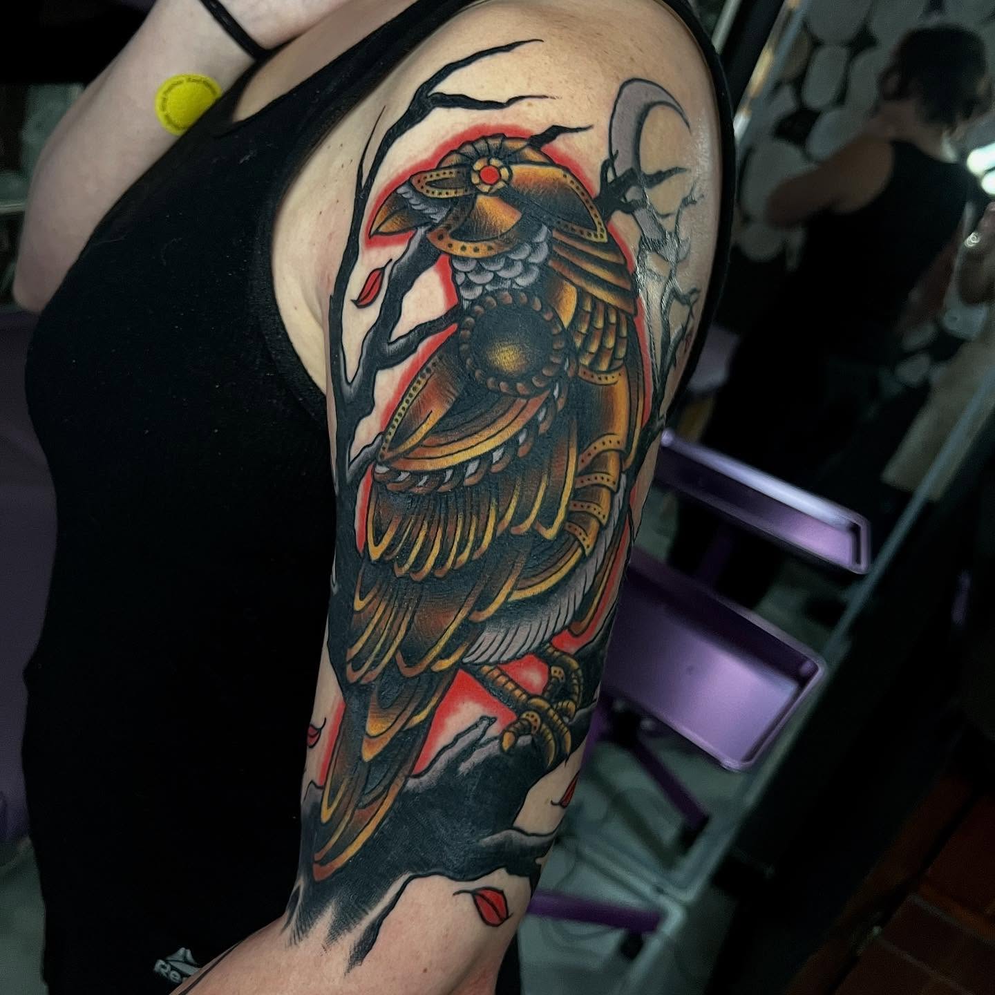 Bird American traditional tattoo on the upper arm by doodle